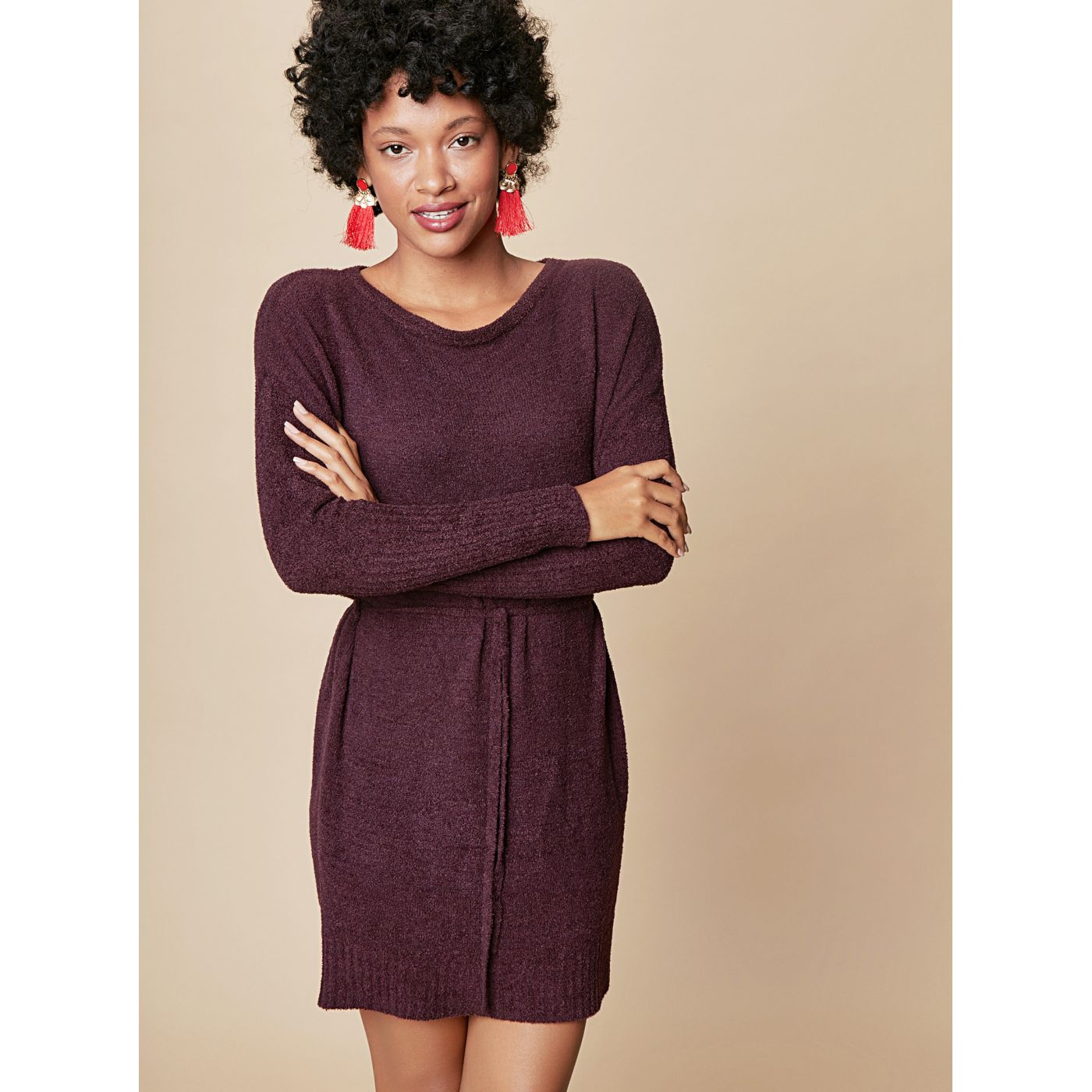 Dark purple sweater mini-dress with long sleeves and touch me ties.
