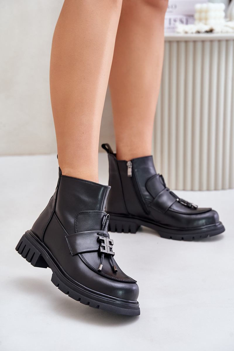 Leather ankle boots on a flat heel with a black insulated black Asperra decoration