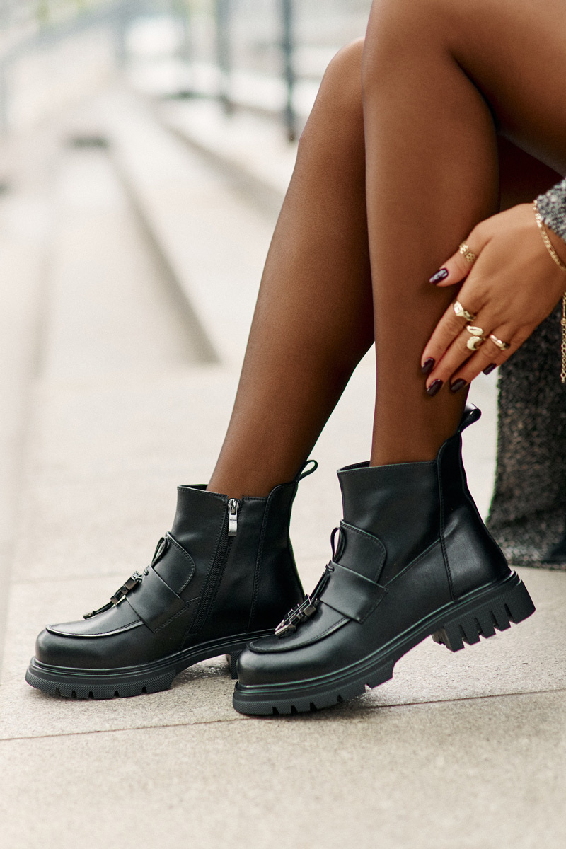 Leather ankle boots on a flat heel with a black insulated black Asperra decoration