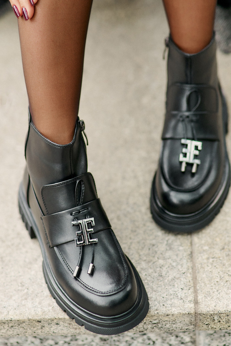 Leather ankle boots on a flat heel with a black insulated black Asperra decoration