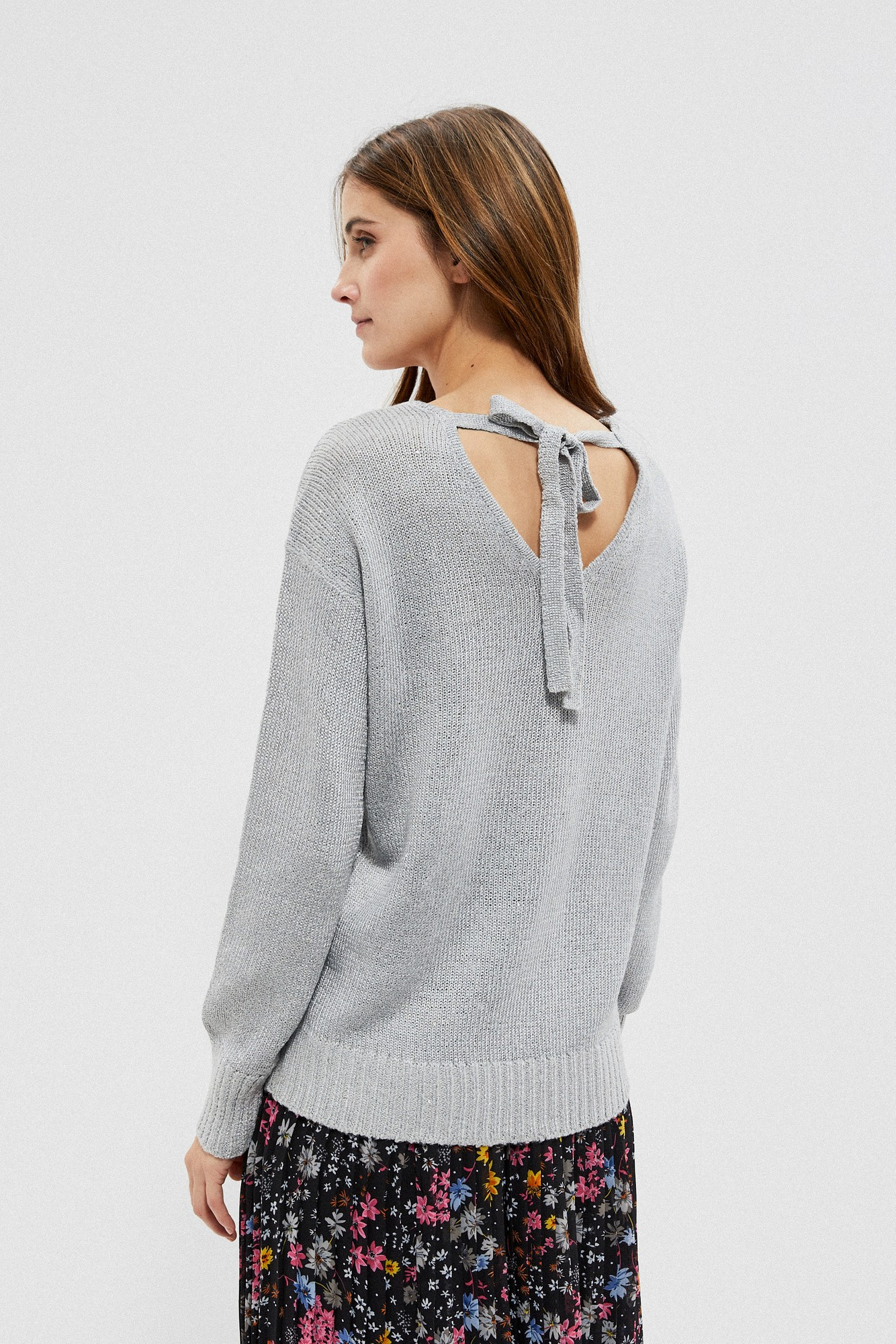 Sweater with a neckline on the back