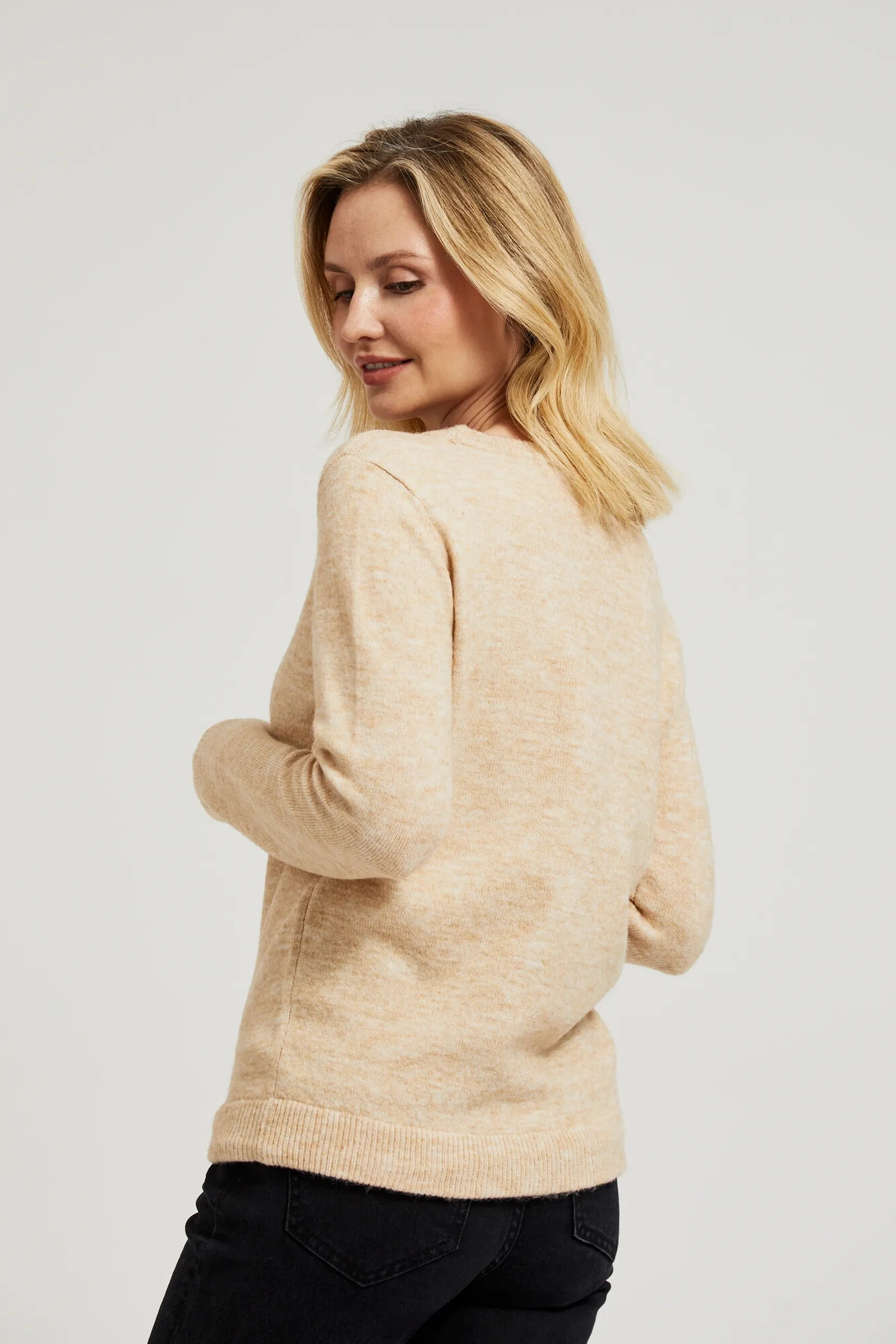 Beige sweater with a round neckline and waist tie