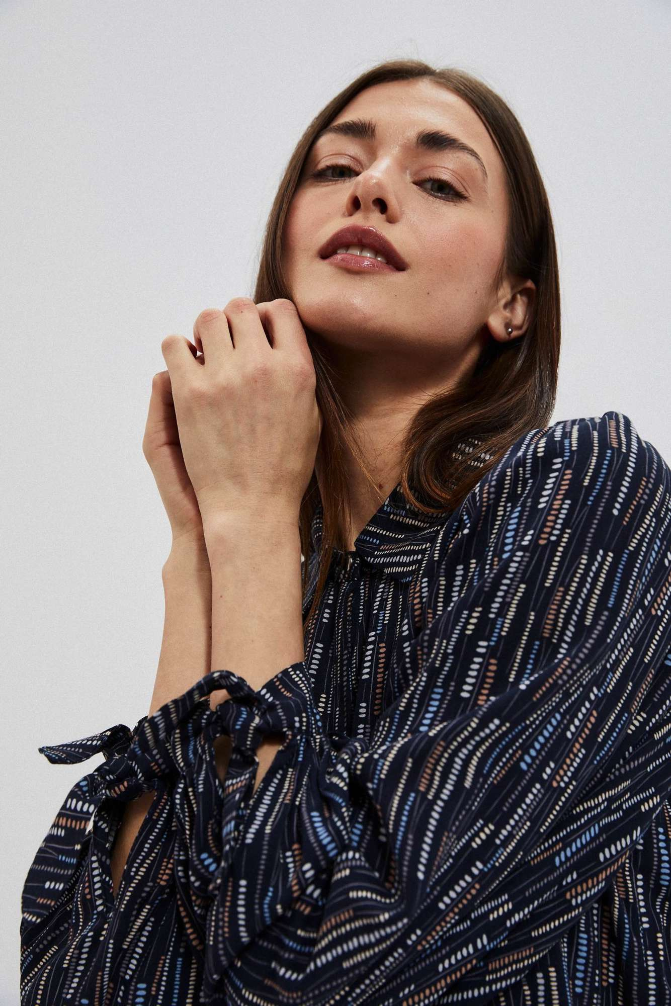 Women's shirt with tie on the sleeves