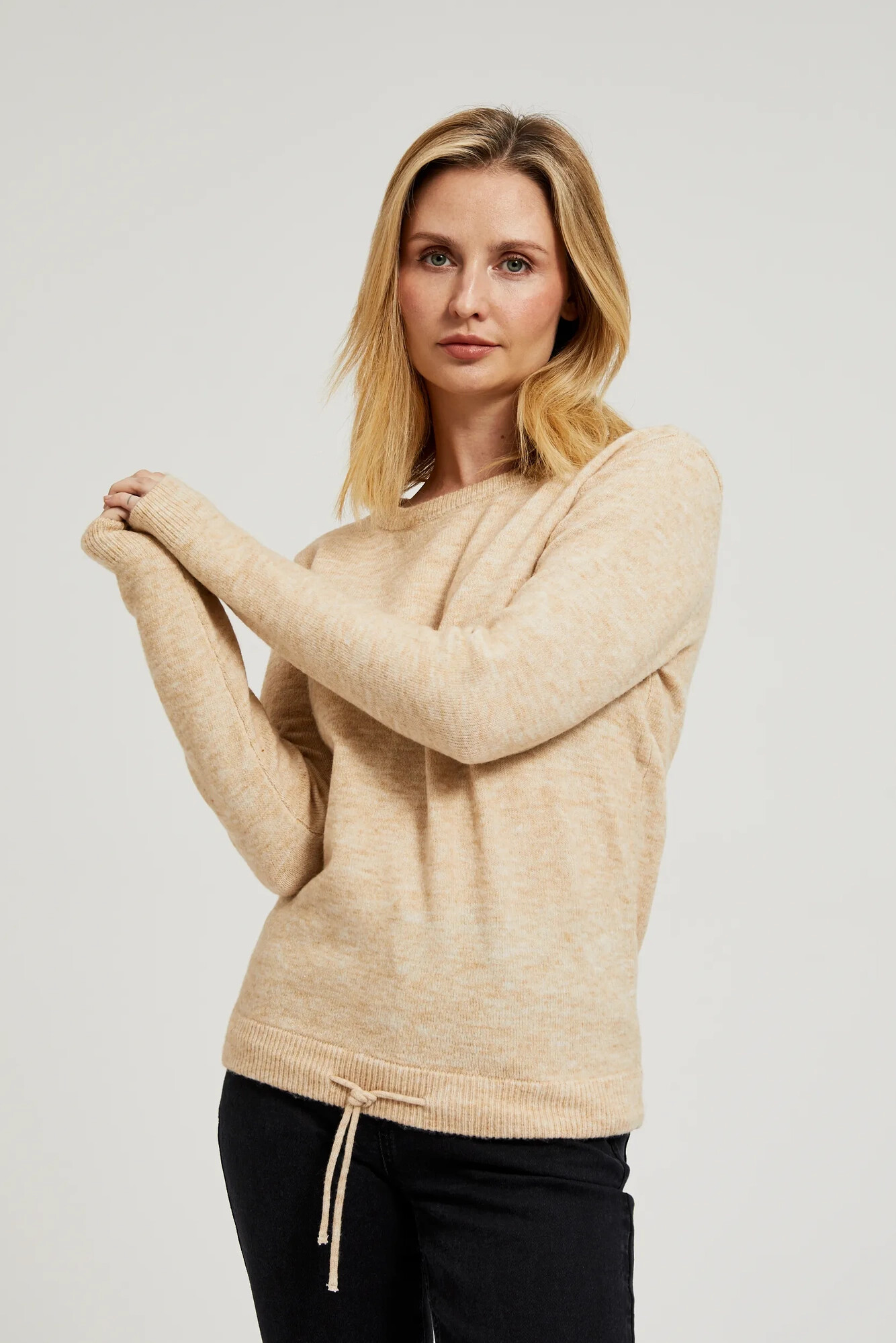 Beige sweater with a round neckline and waist tie