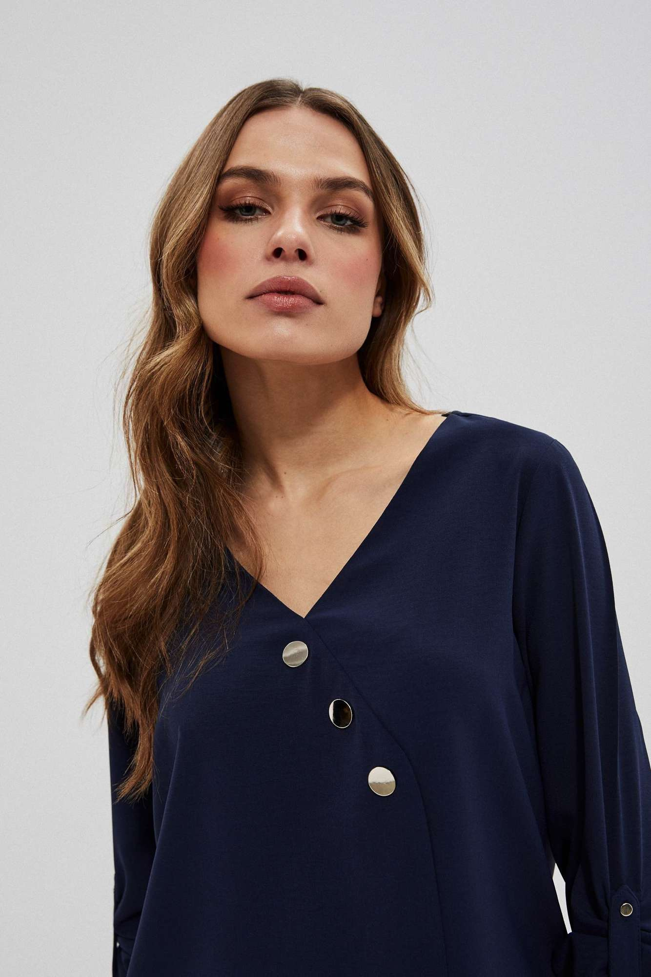 Shirt with decorative buttons