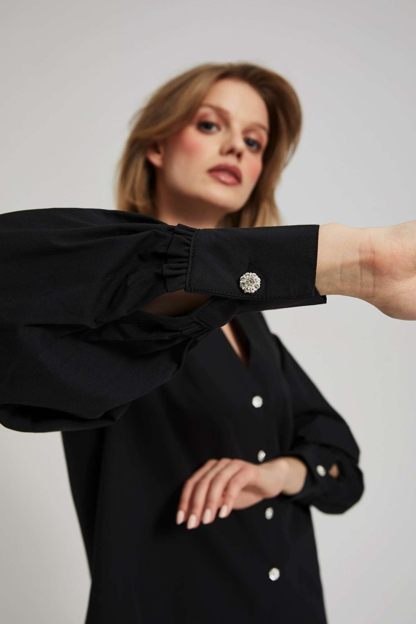 Shirt with decorative buttons