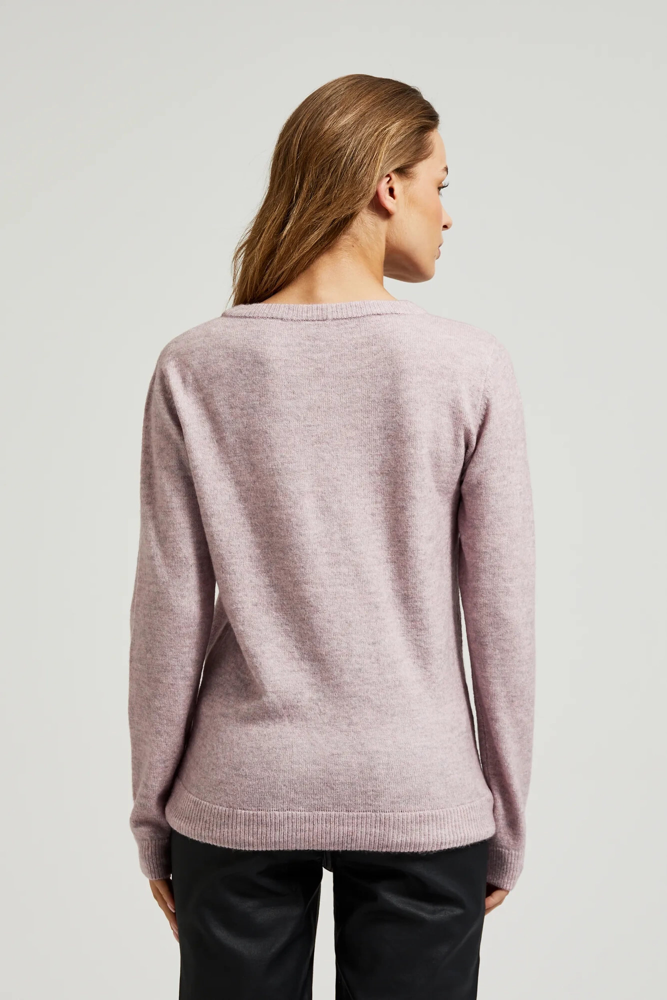 Pink sweater with a round neckline and waist tie