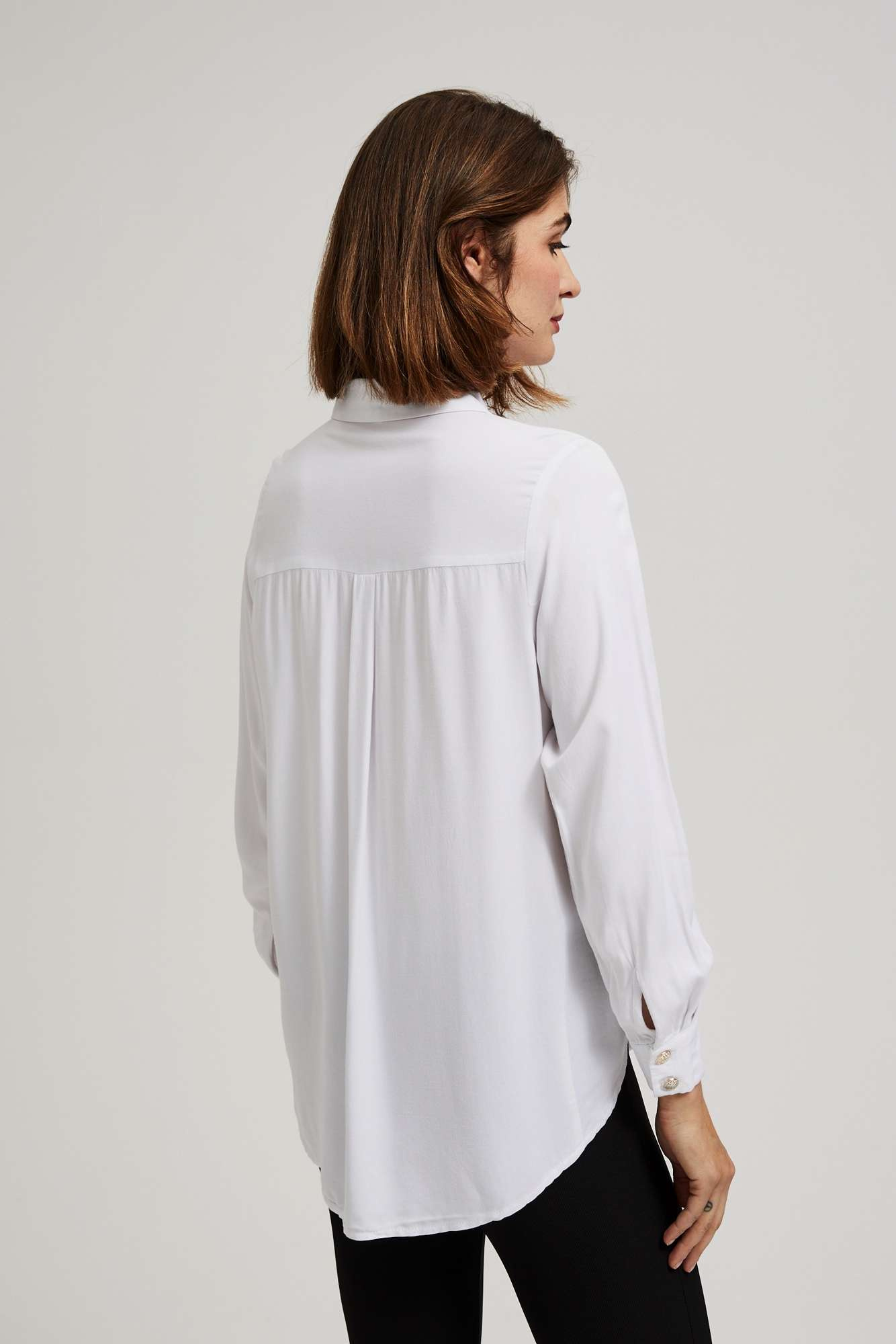 Shirt with decorative buttons