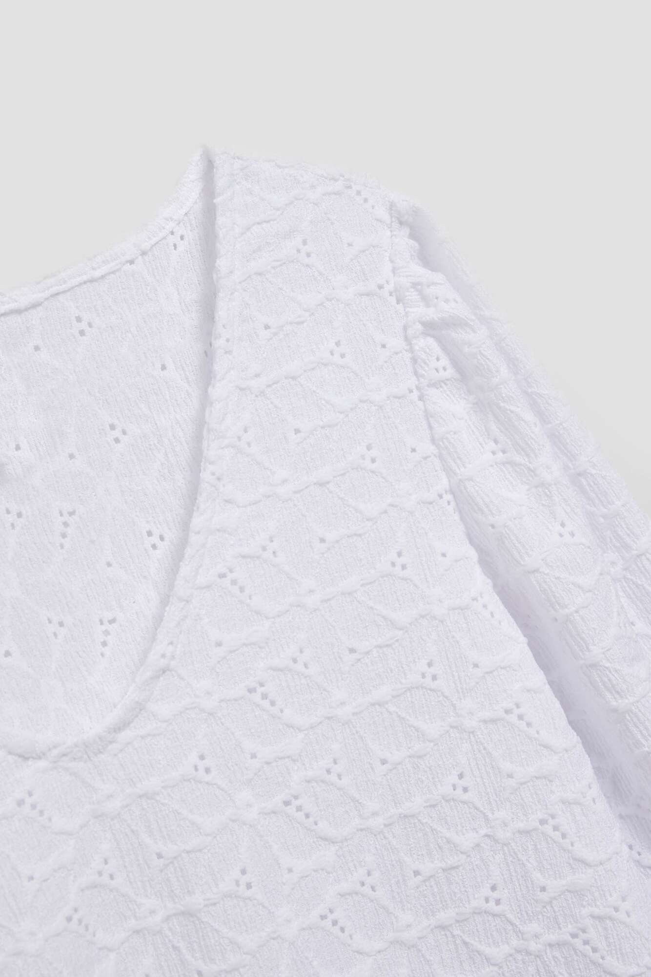 Openwork blouse with a V-neck