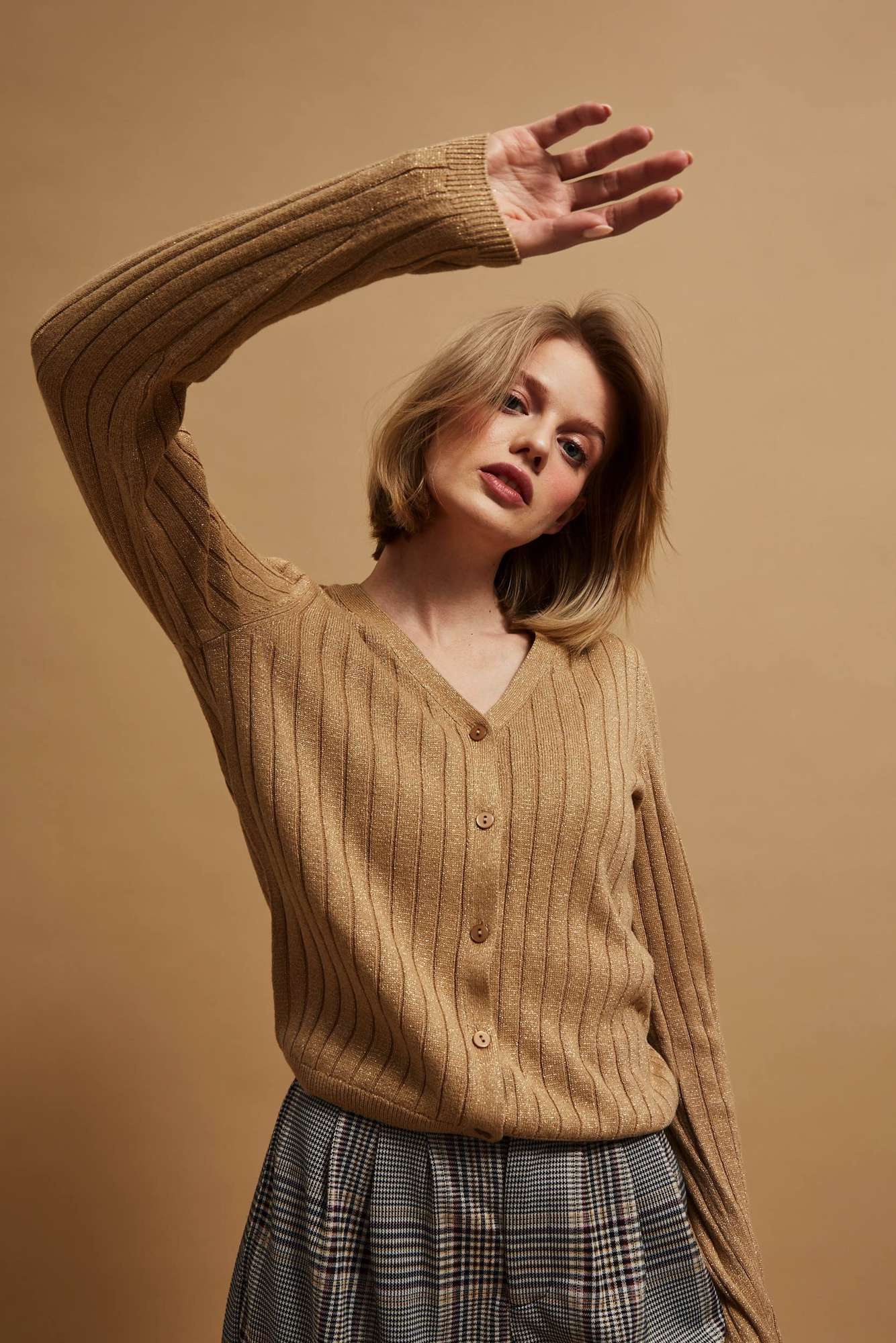 Sweater decorated with metallic thread