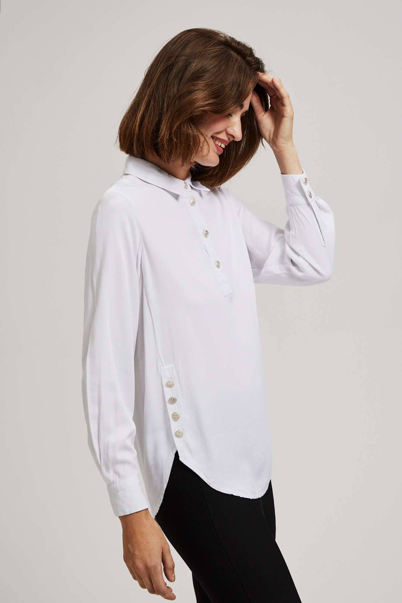 Shirt with decorative buttons