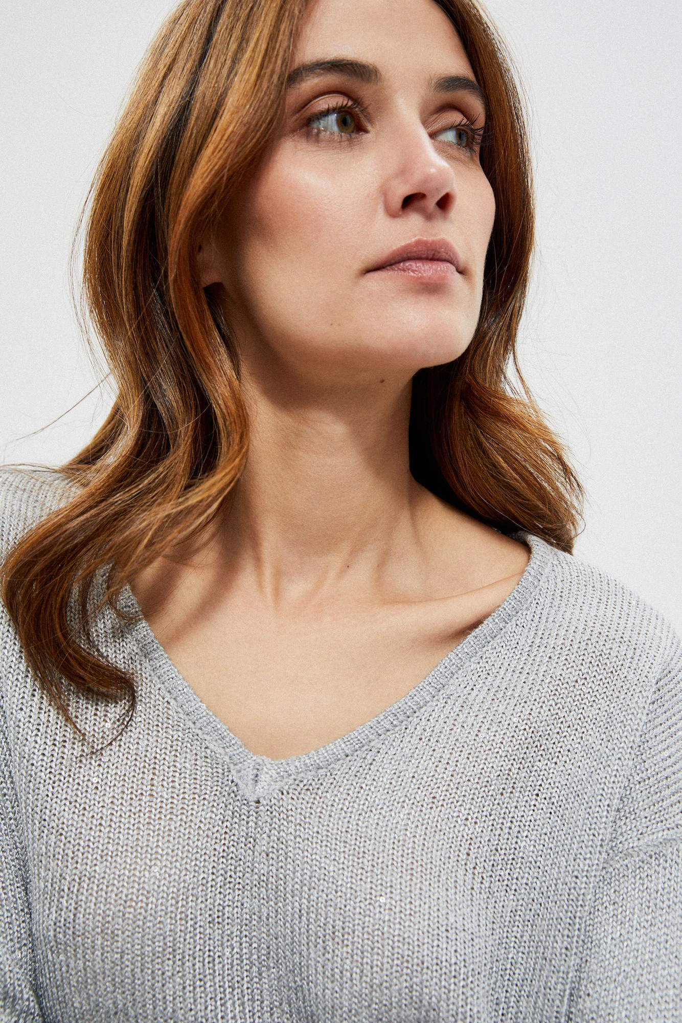 Sweater with a neckline on the back