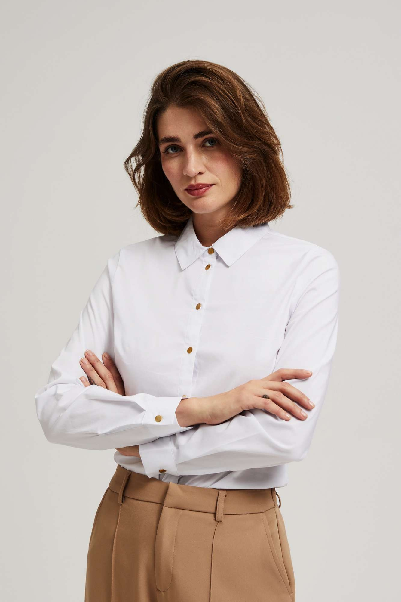 Plain shirt with decorative buttons