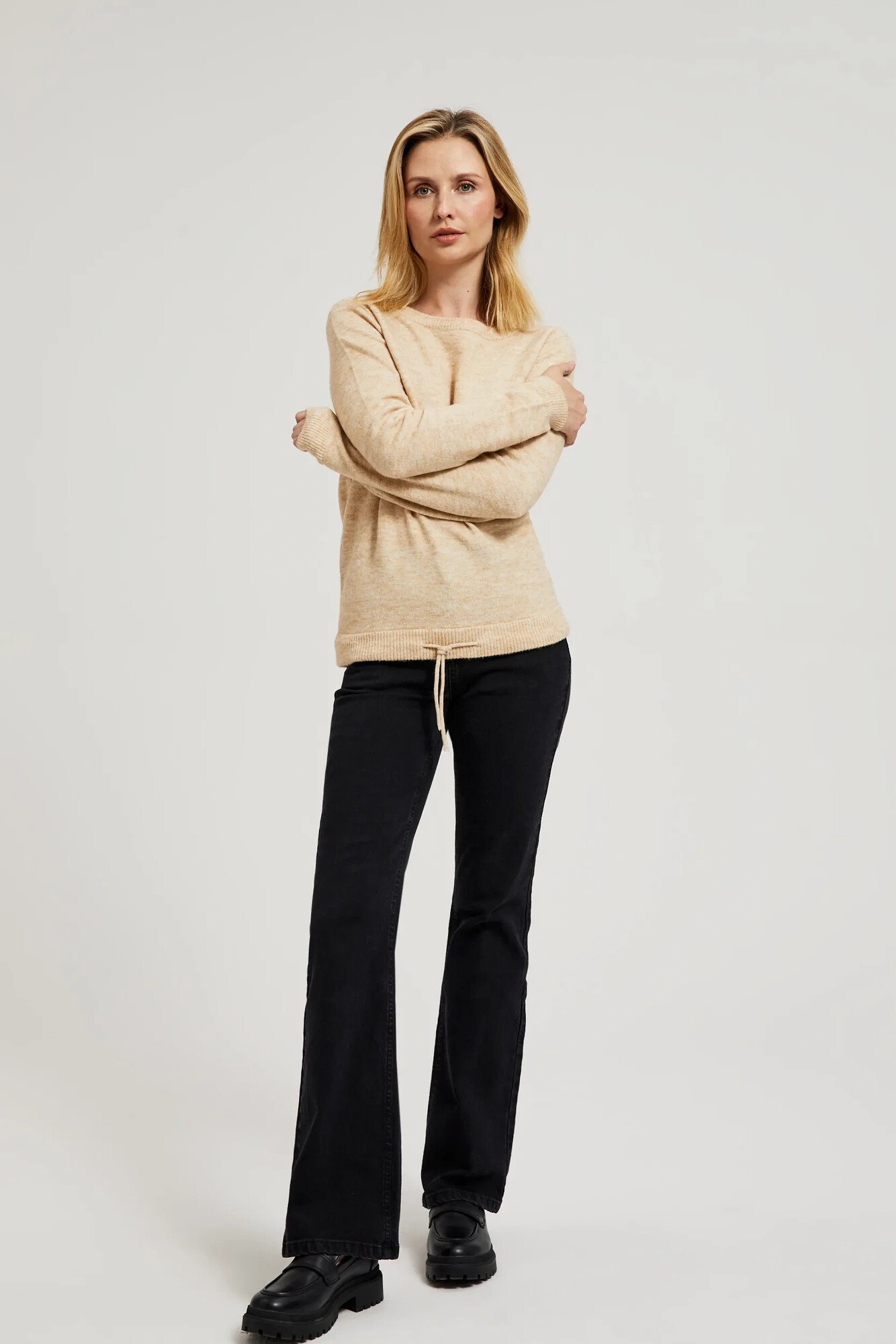 Beige sweater with a round neckline and waist tie