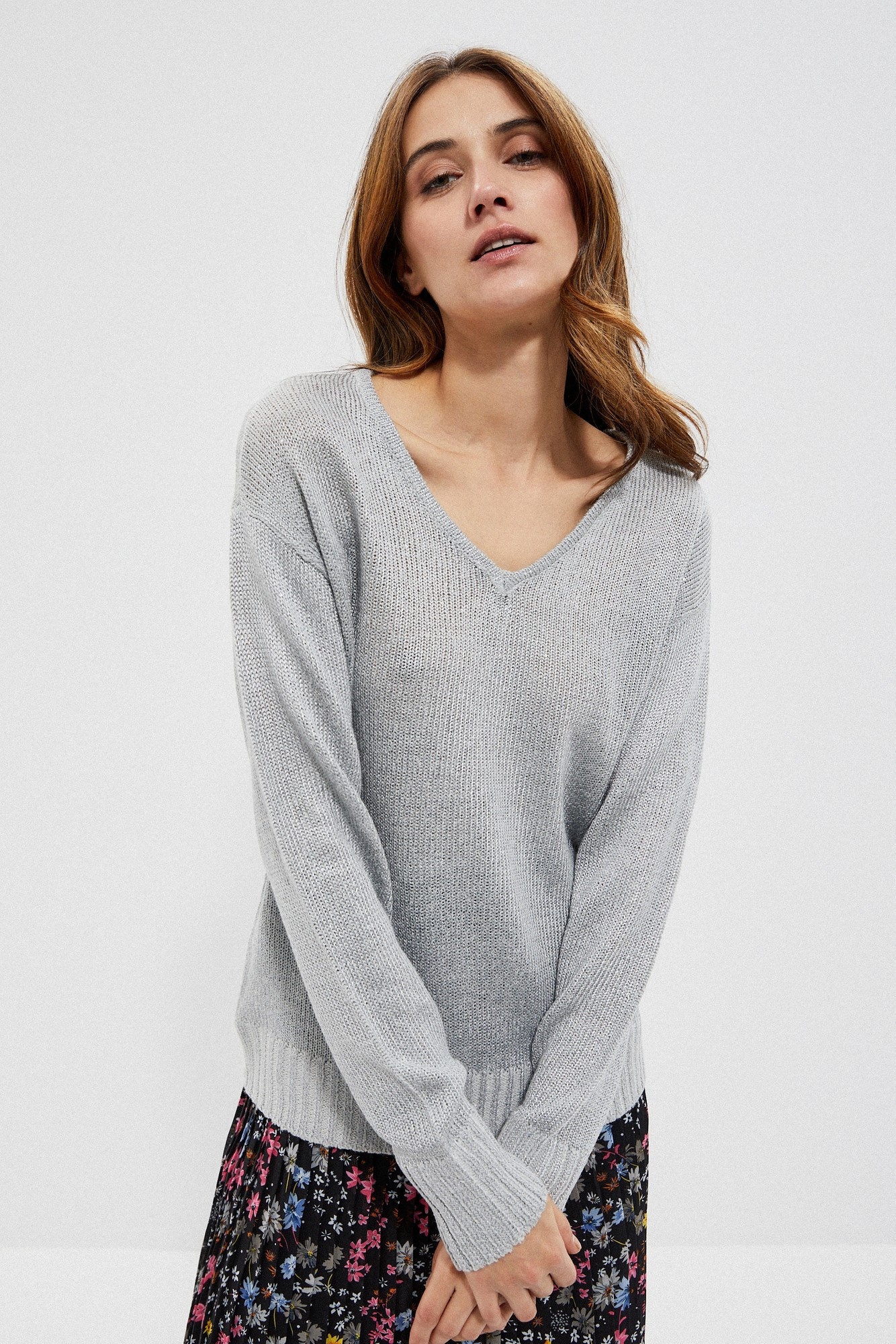 Sweater with a neckline on the back
