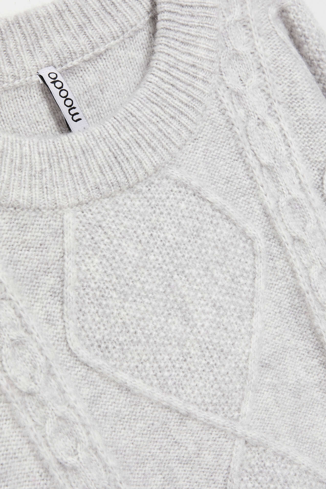 Sweater with decorative fabric