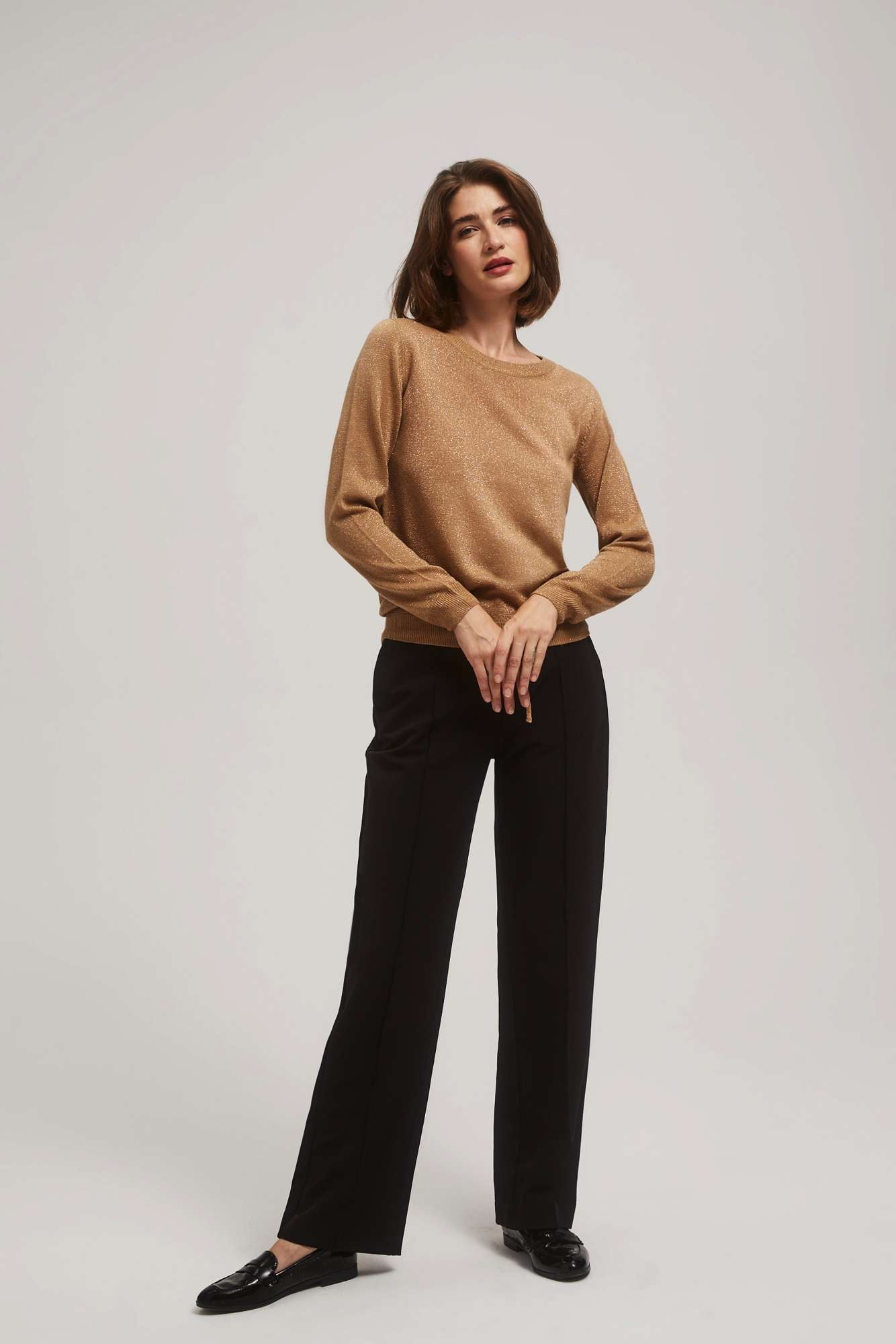 Sweater with metal thread and tie-up