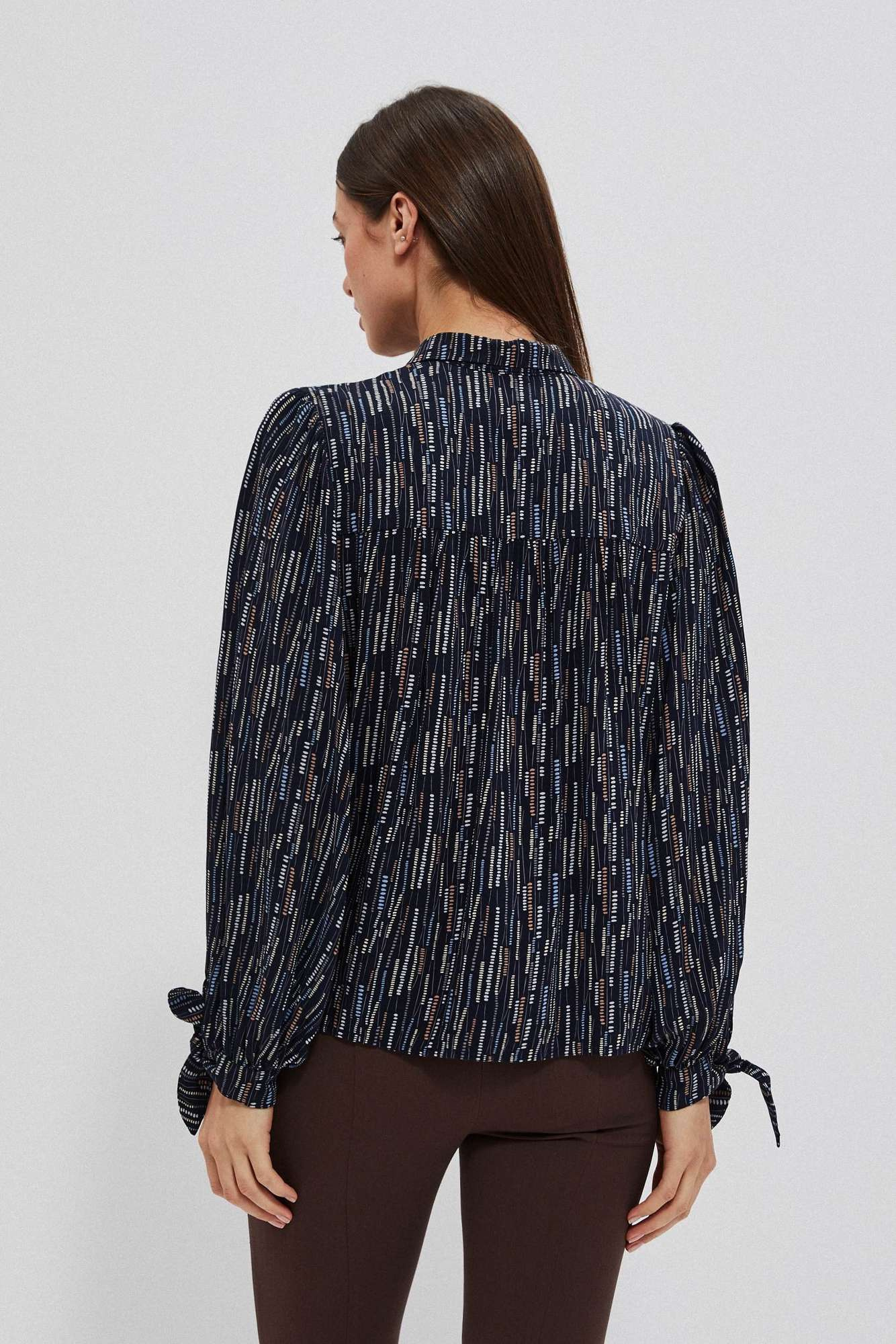 Women's shirt with tie on the sleeves