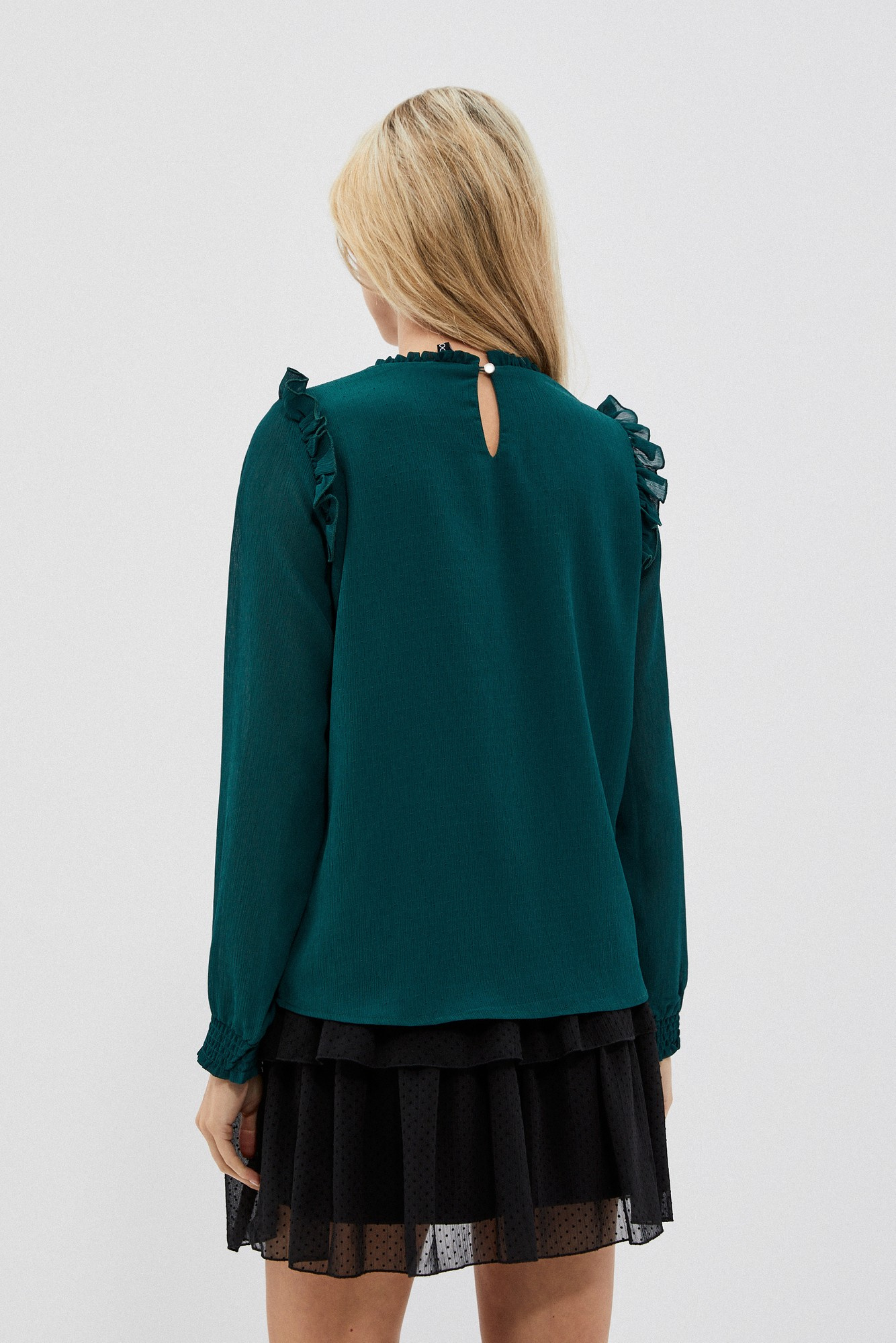 Shirt with ruffles on the shoulders