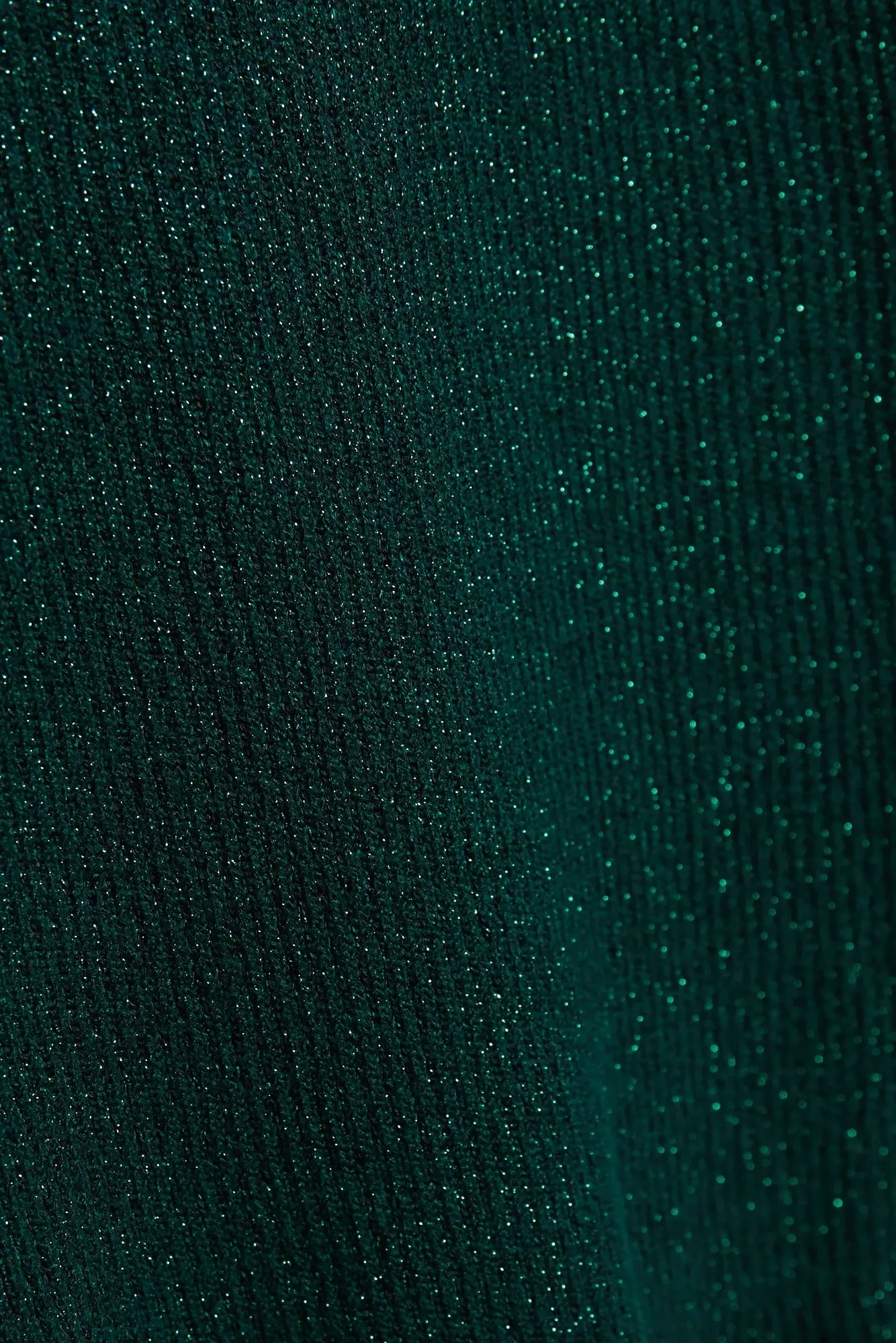 Turtleneck sweater decorated with metallic thread