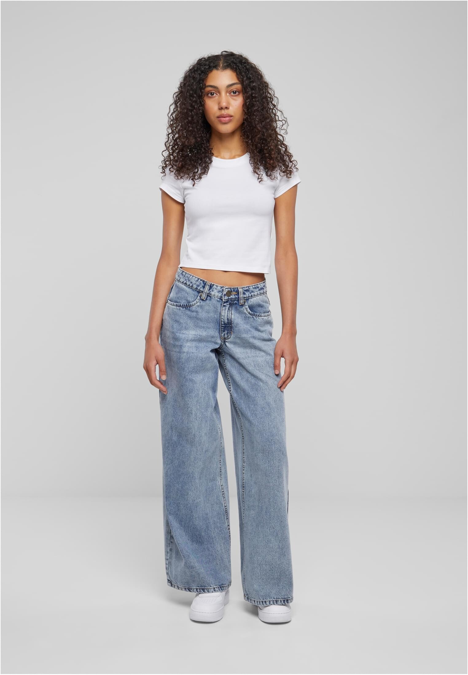 Women's jeans with a wide waist light blue denim