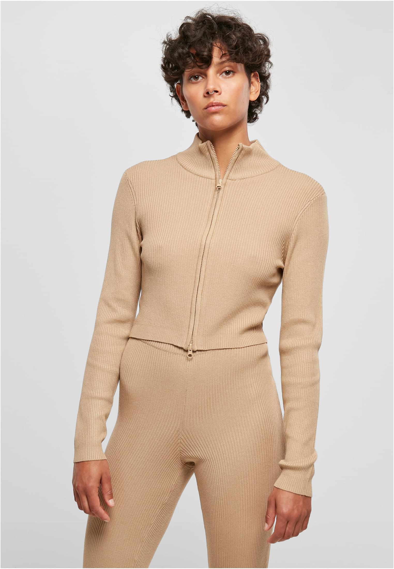 Women&#039;s sweater with zipper in beige color