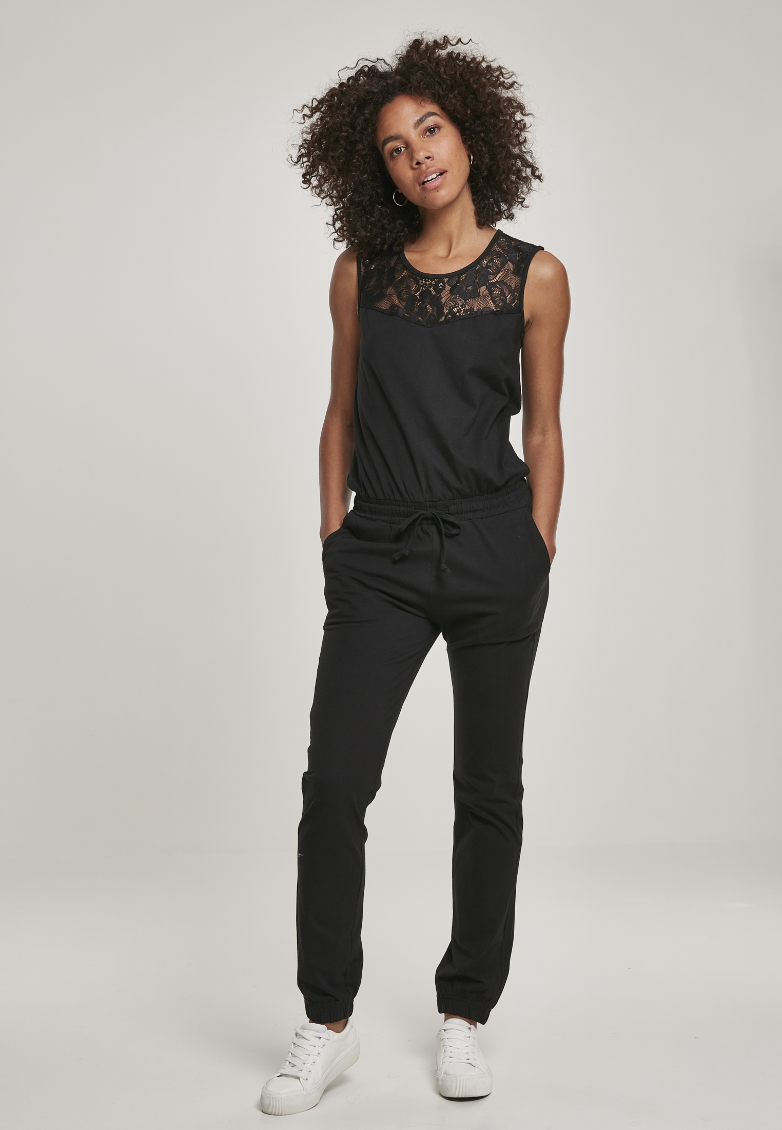 Women&#039;s jumpsuit with a black lace block