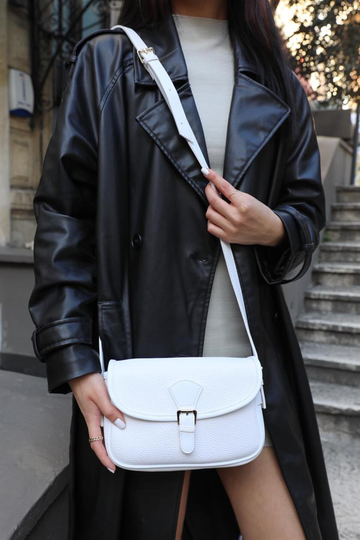 Levně Madamra White Women's Crossbody Bag with Buckle Flap