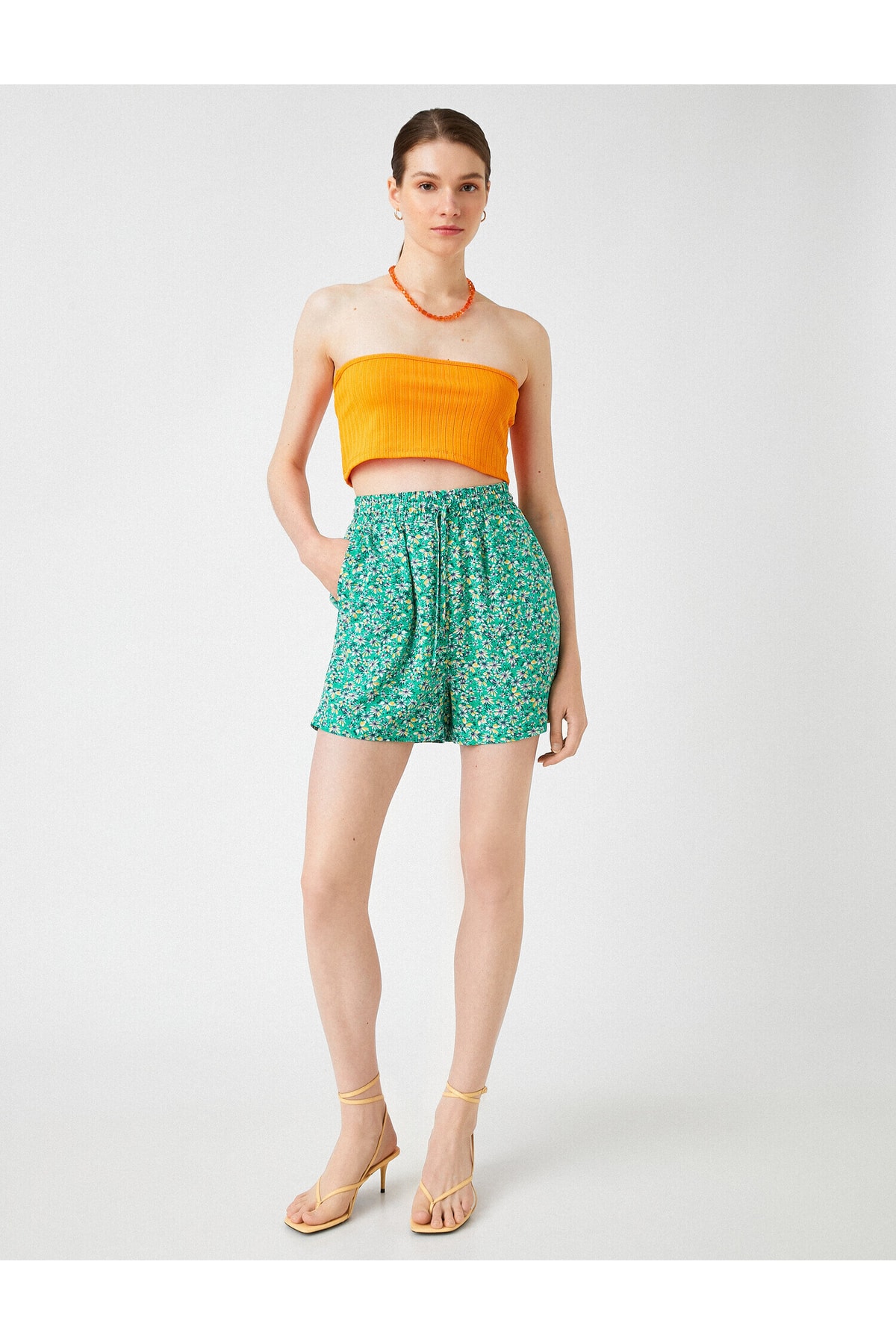 Koton Floral Mini Shorts that are tied at the waist with pockets.