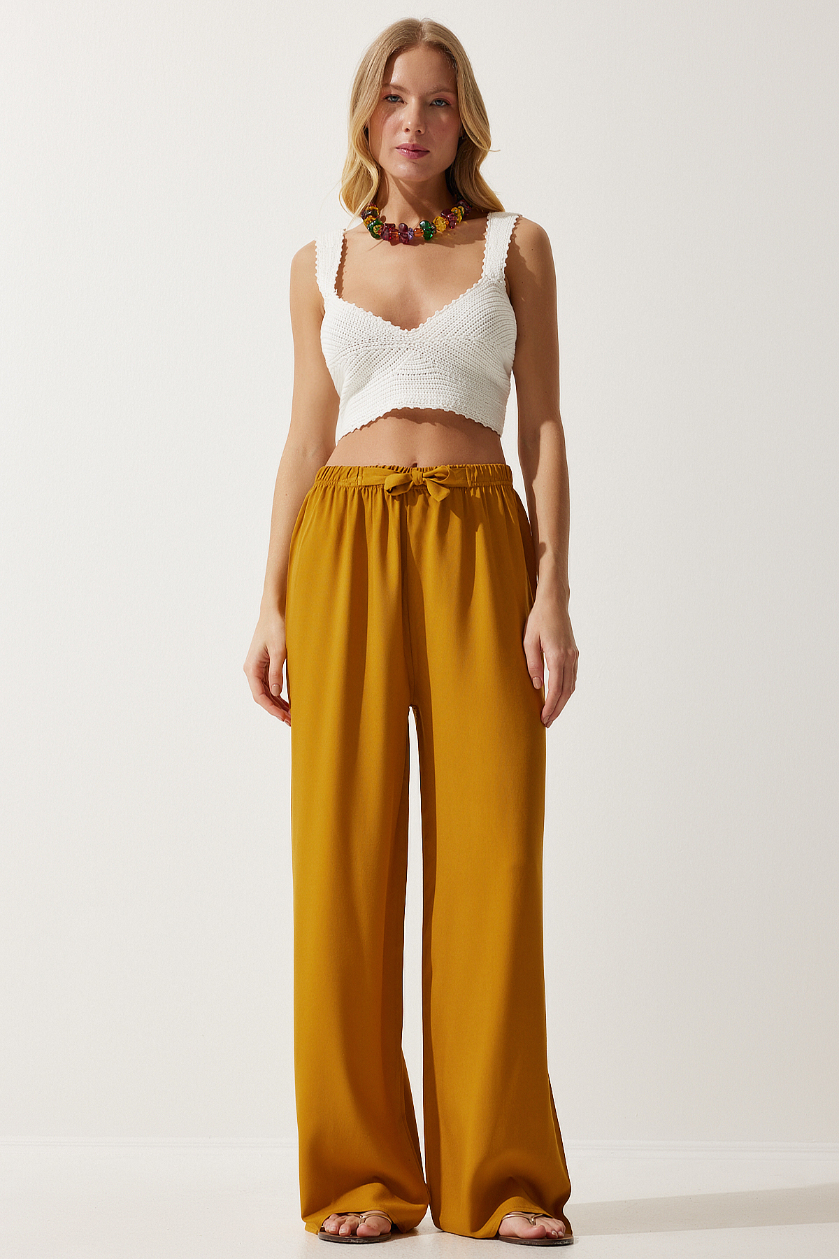 Levně Happiness İstanbul Women's Mustard Flowy Knitted Palazzo Trousers