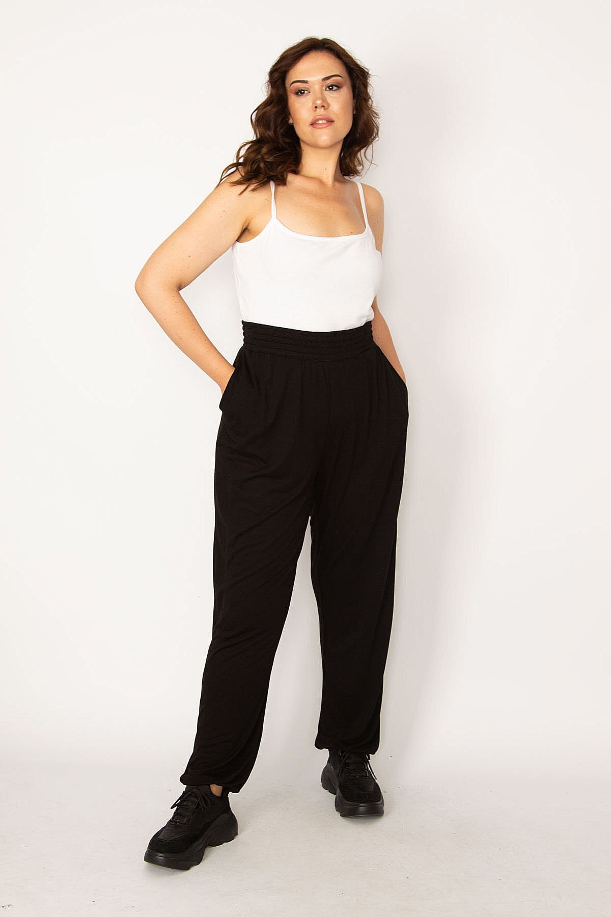 Levně Şans Women's Plus Size Black Sport Trousers with Elastic Waist and Legs, and a comfortable cut with pockets