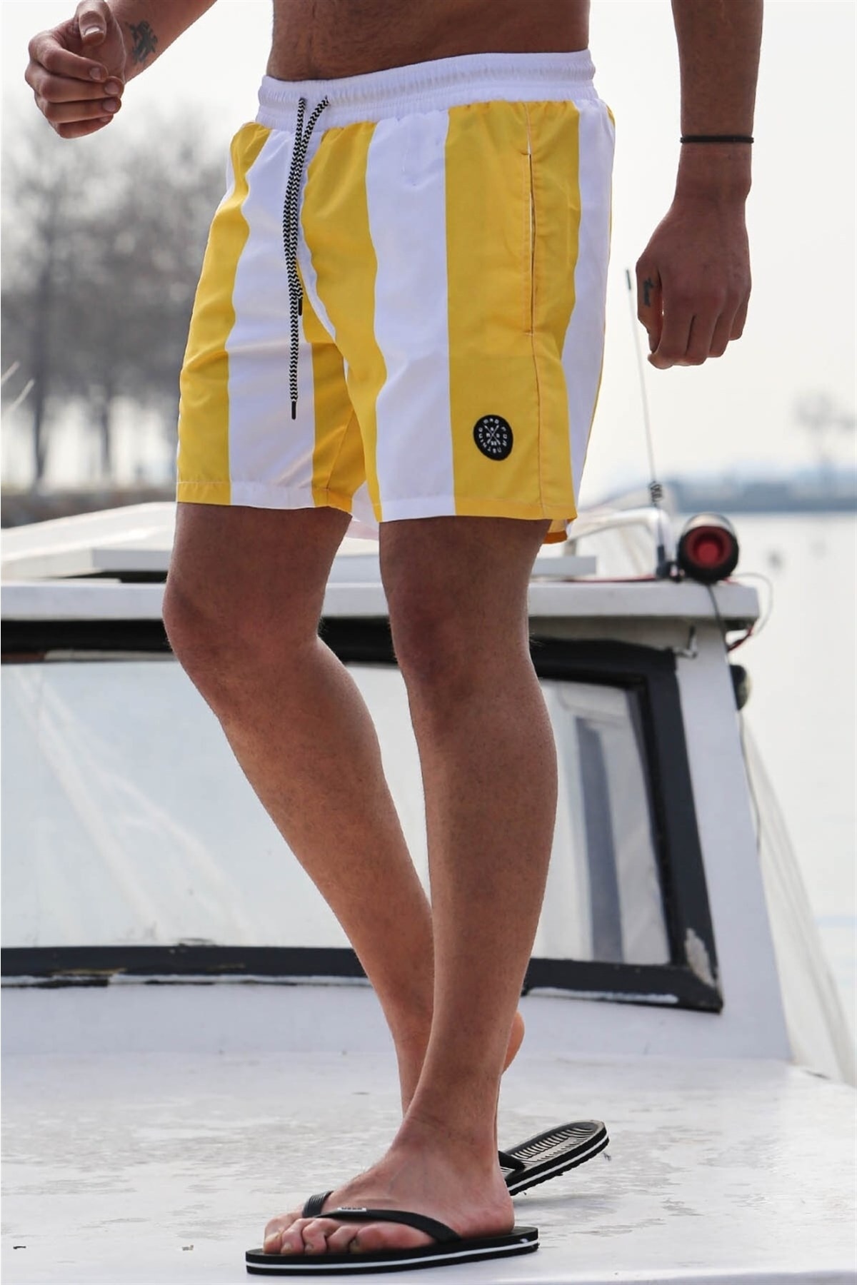 Levně Madmext Men's Yellow Striped Beach Shorts 6360