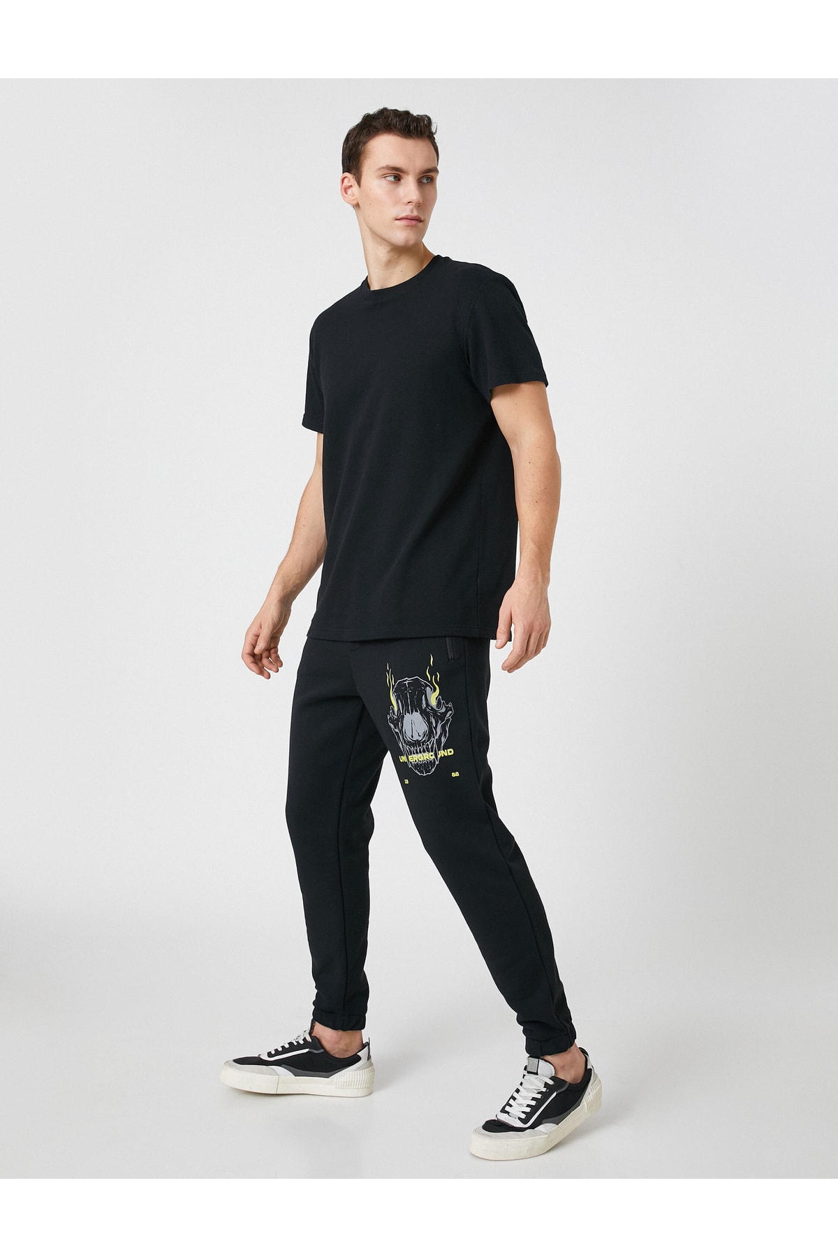 Koton Jogger Sweatpants with a skull print, zippered pockets, Lace-Up Waist.