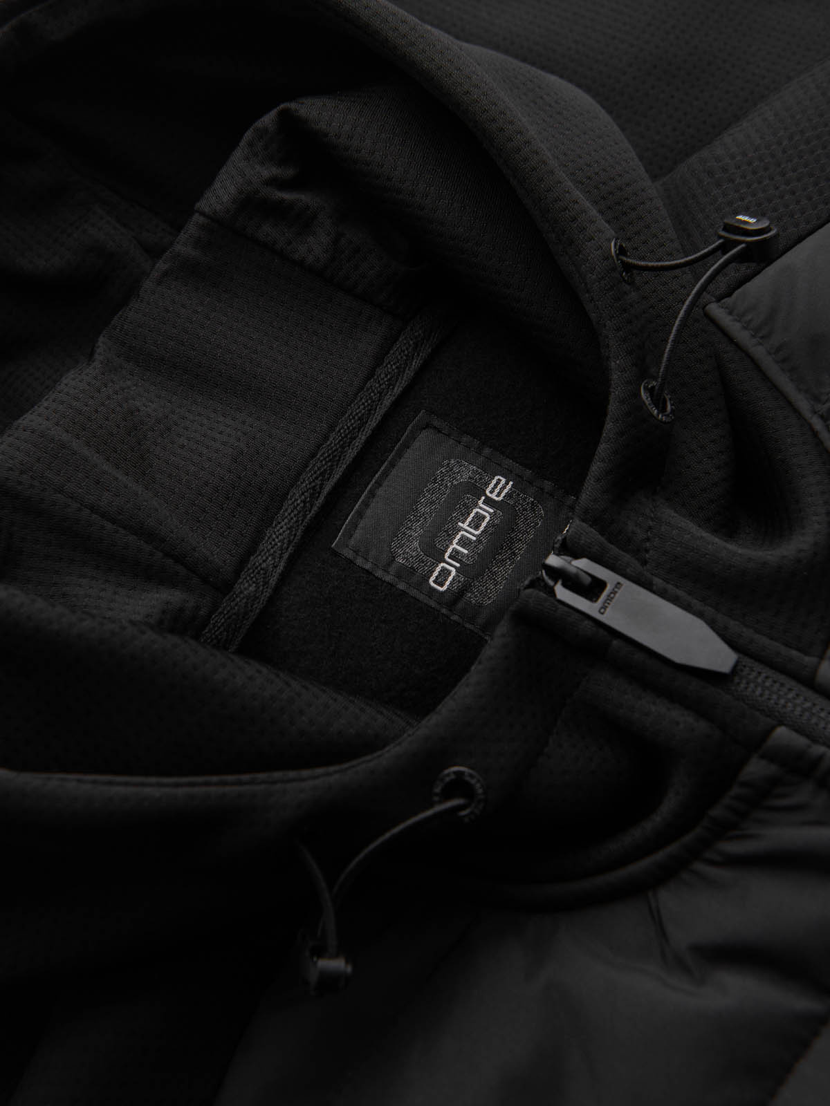 Ombre Men&#039;s lightweight jacket of combined materials with hood and decorative quilting - black