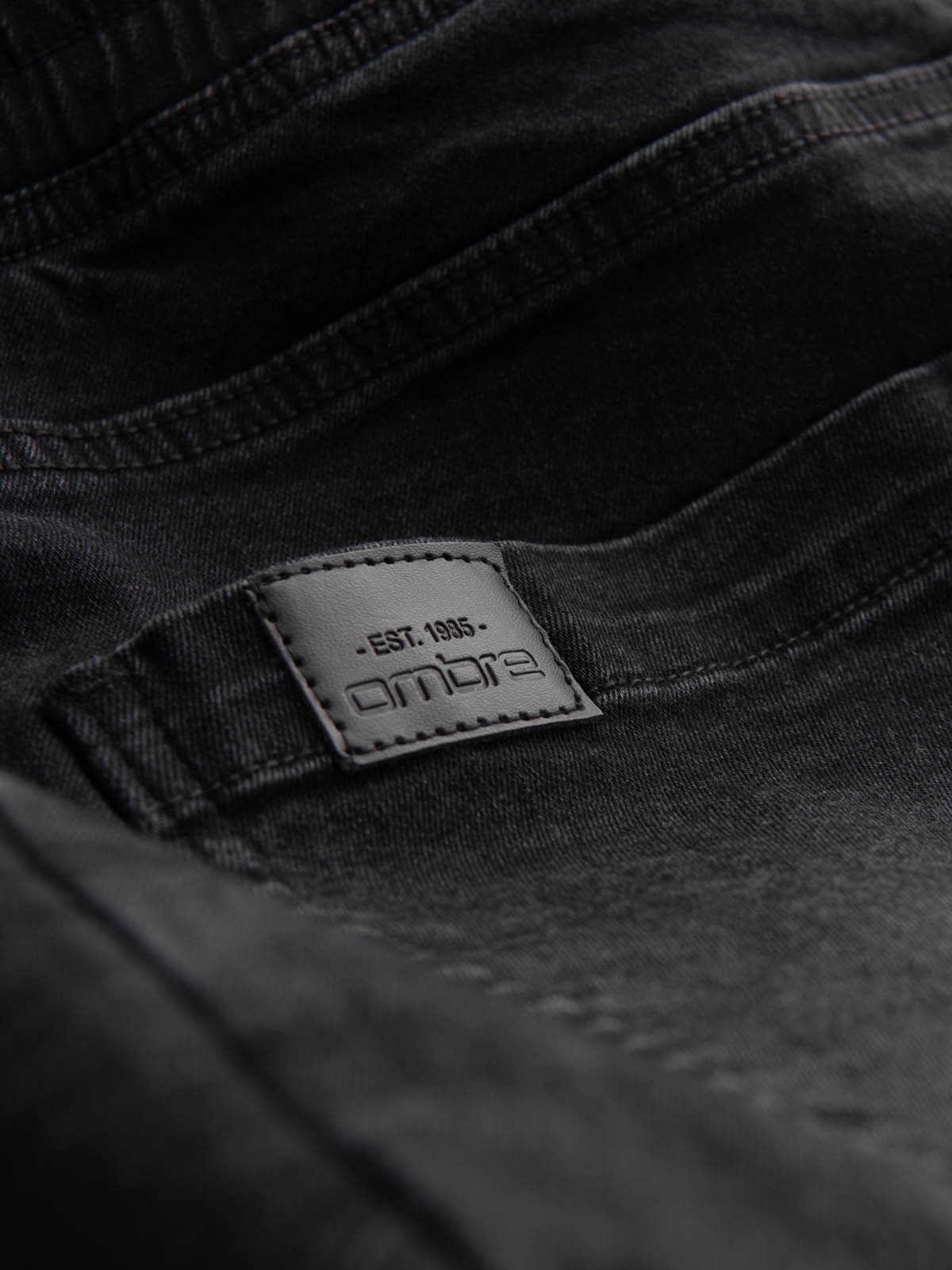 Ombre Men&#039;s denim joggers with asymmetrical stitching - black