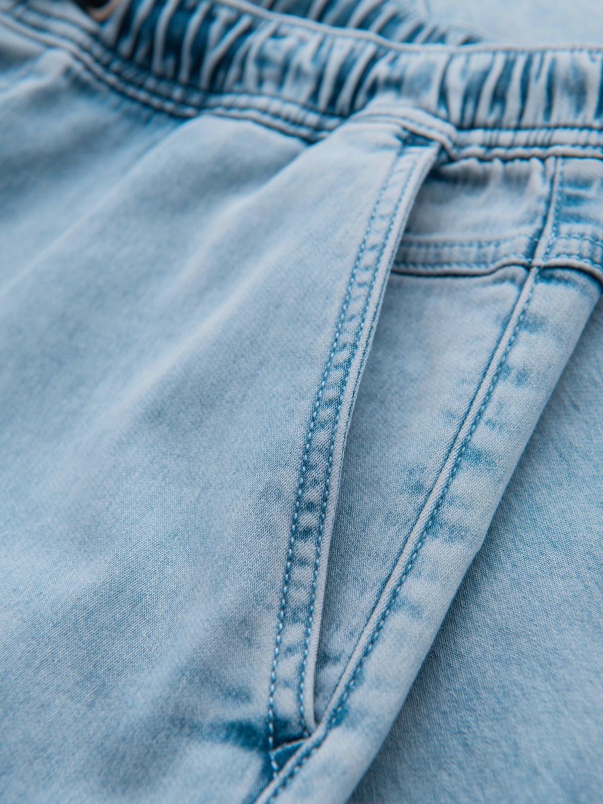 Ombre Men's short denim shorts with decorative stitching - light blue