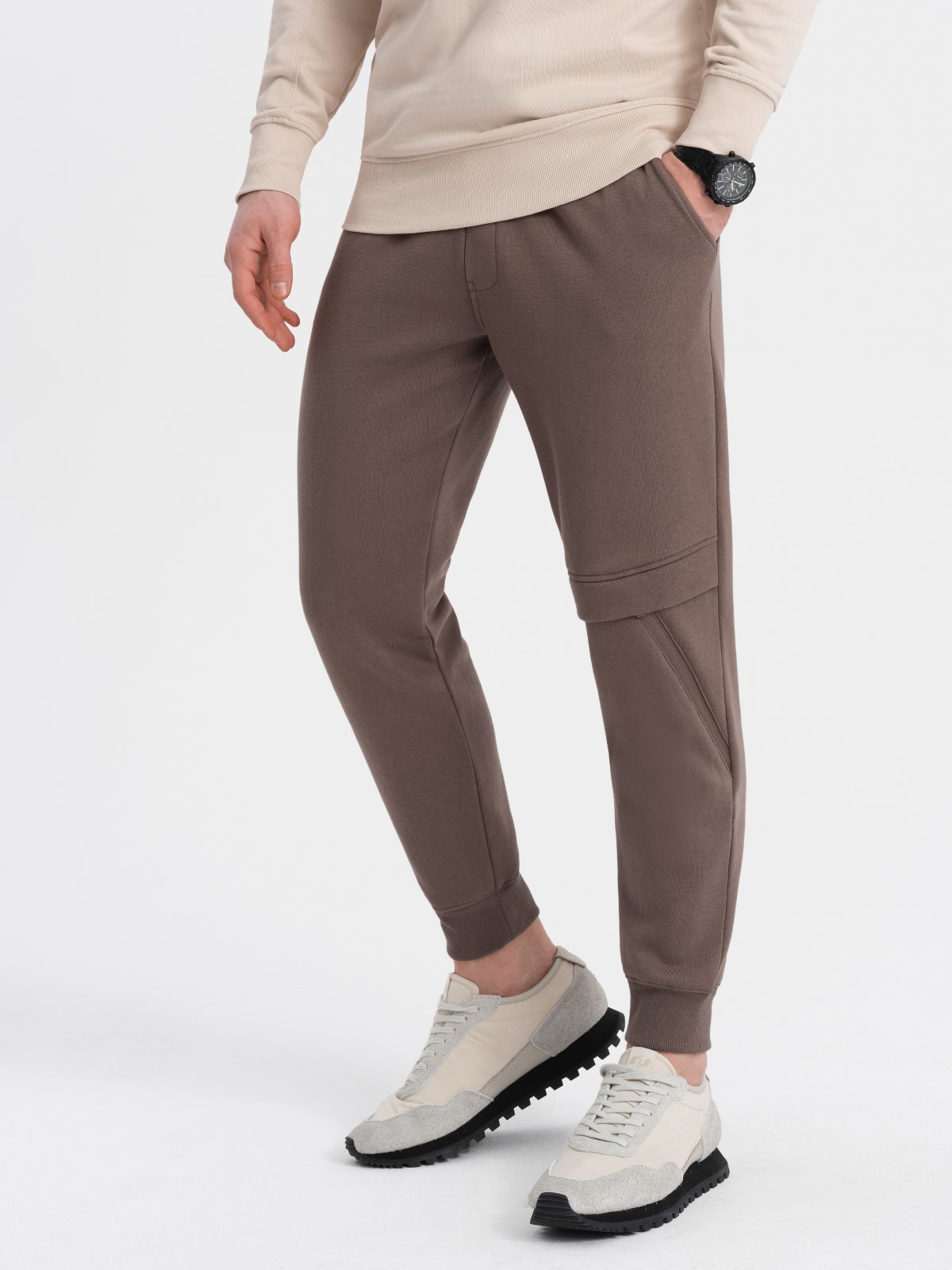 Levně Ombre Men's sweatpants with stitching and zipper on leg - brown