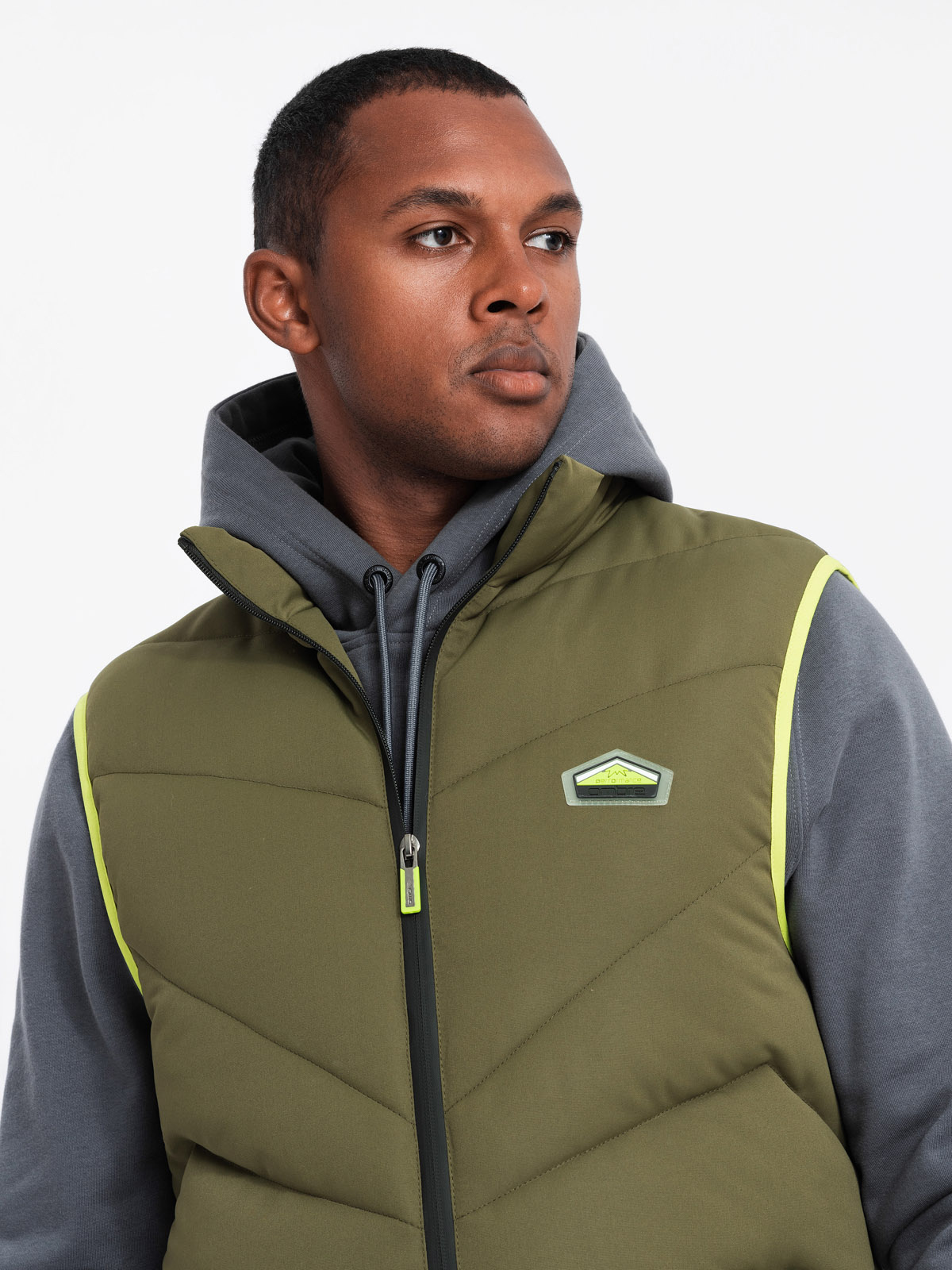 Ombre Men's quilted sleeveless jacket with neon accents - olive