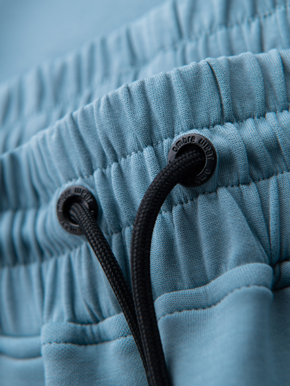 Ombre Men&#039;s sweatpants with ribbed cuffs and decorative zipper - light blue