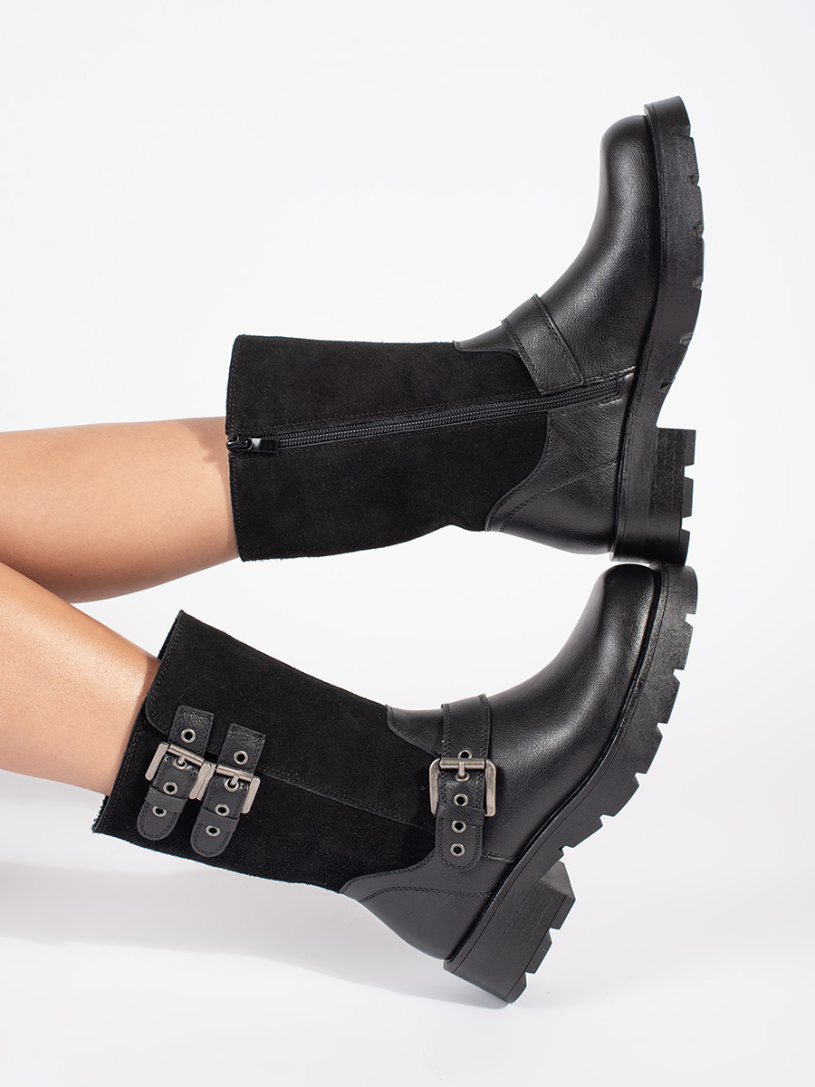 Womens black leather platform boots decorated with Sergio Leone straps