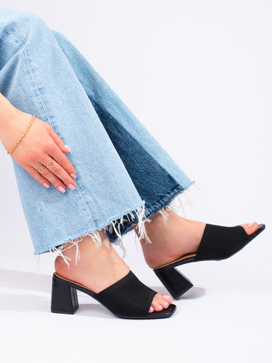 Textile womens black flip-flops on the Shelvt post