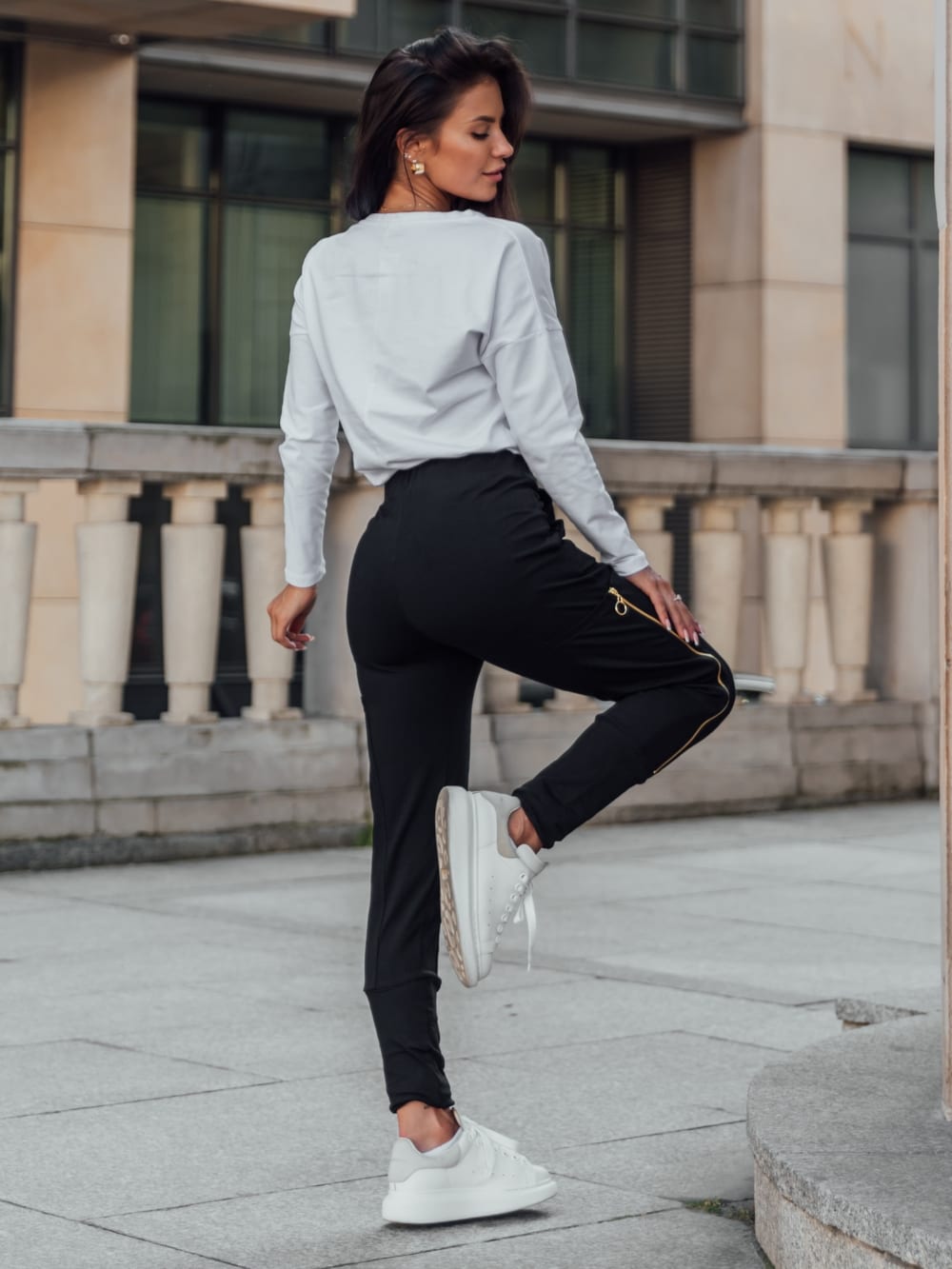 Set of women&#039;s cargo pants and a white and black blouse