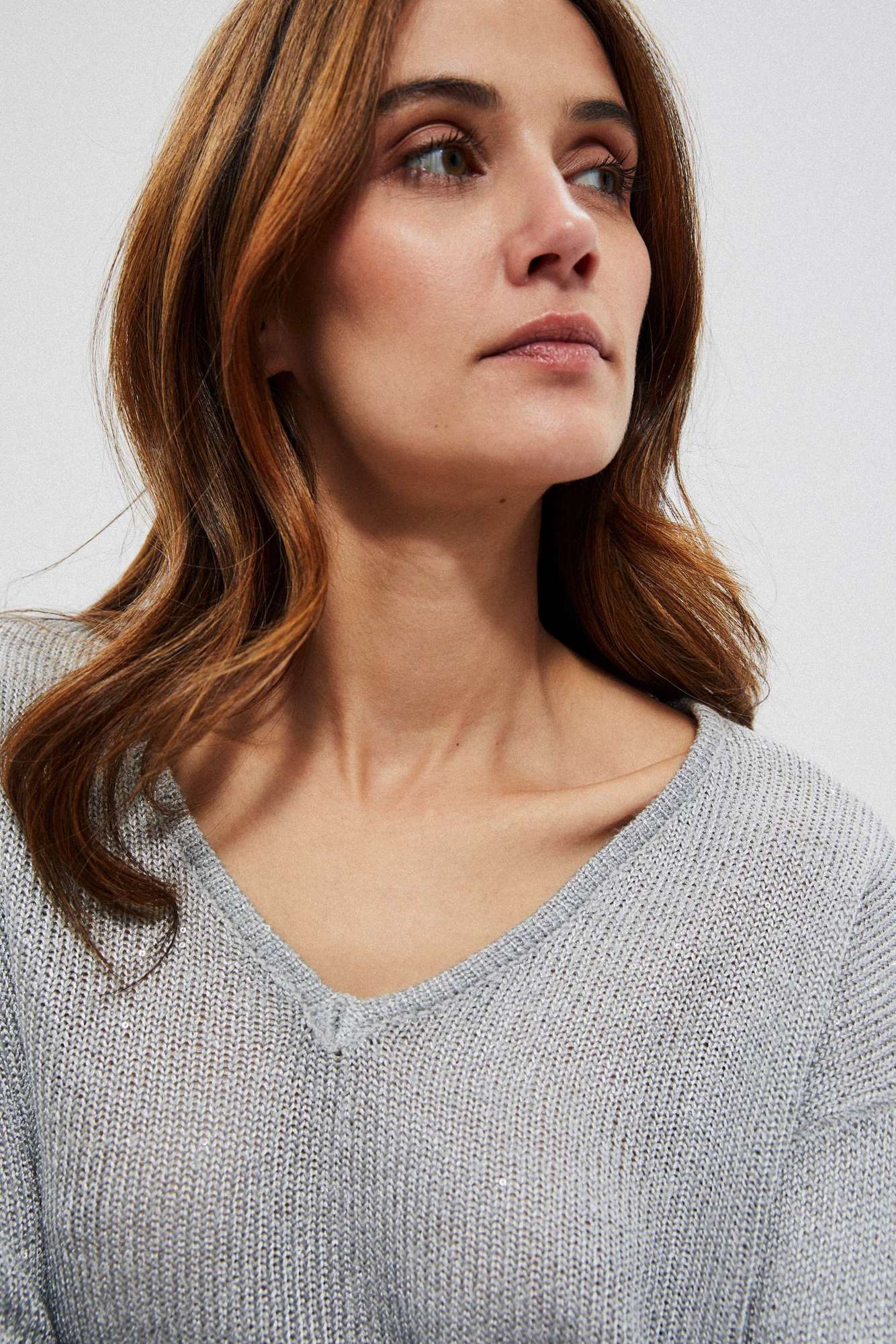 Sweater with a neckline on the back