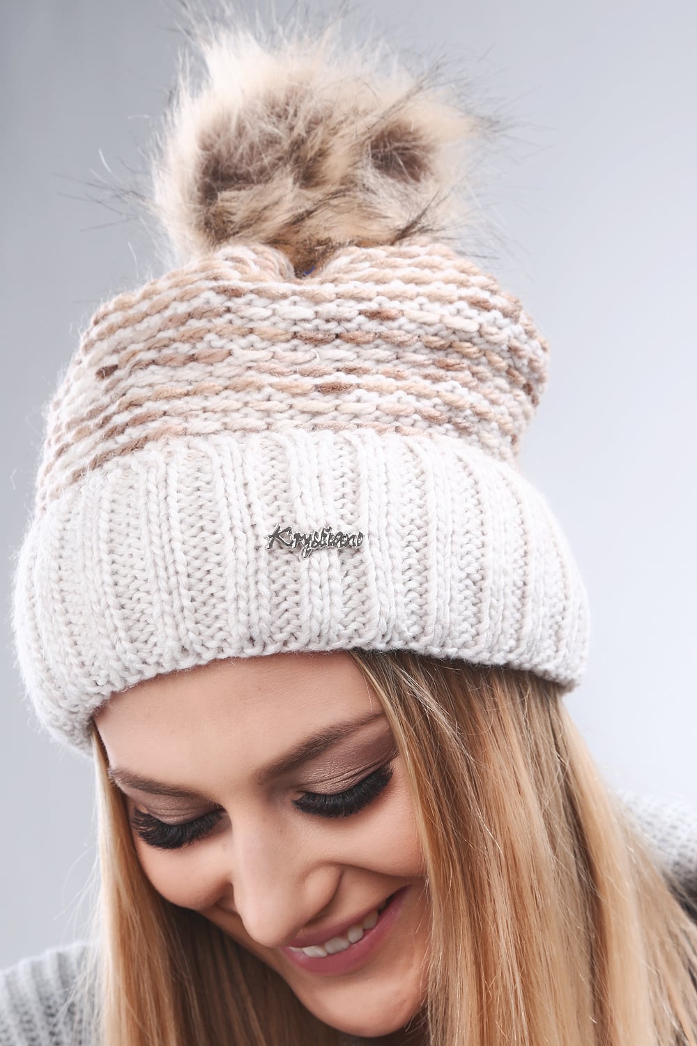 Beige winter cap with hem