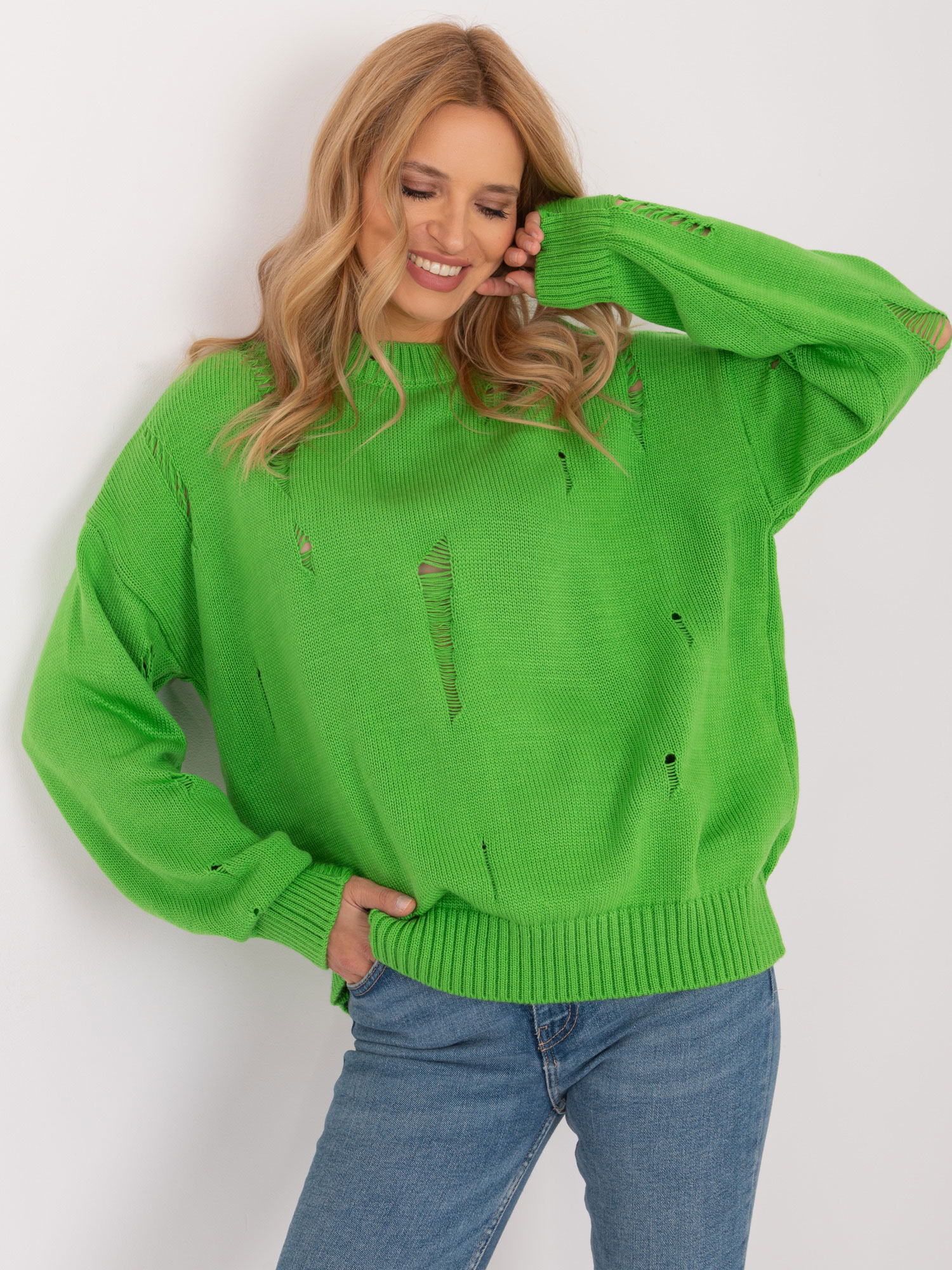 Light green women's oversize sweater with holes