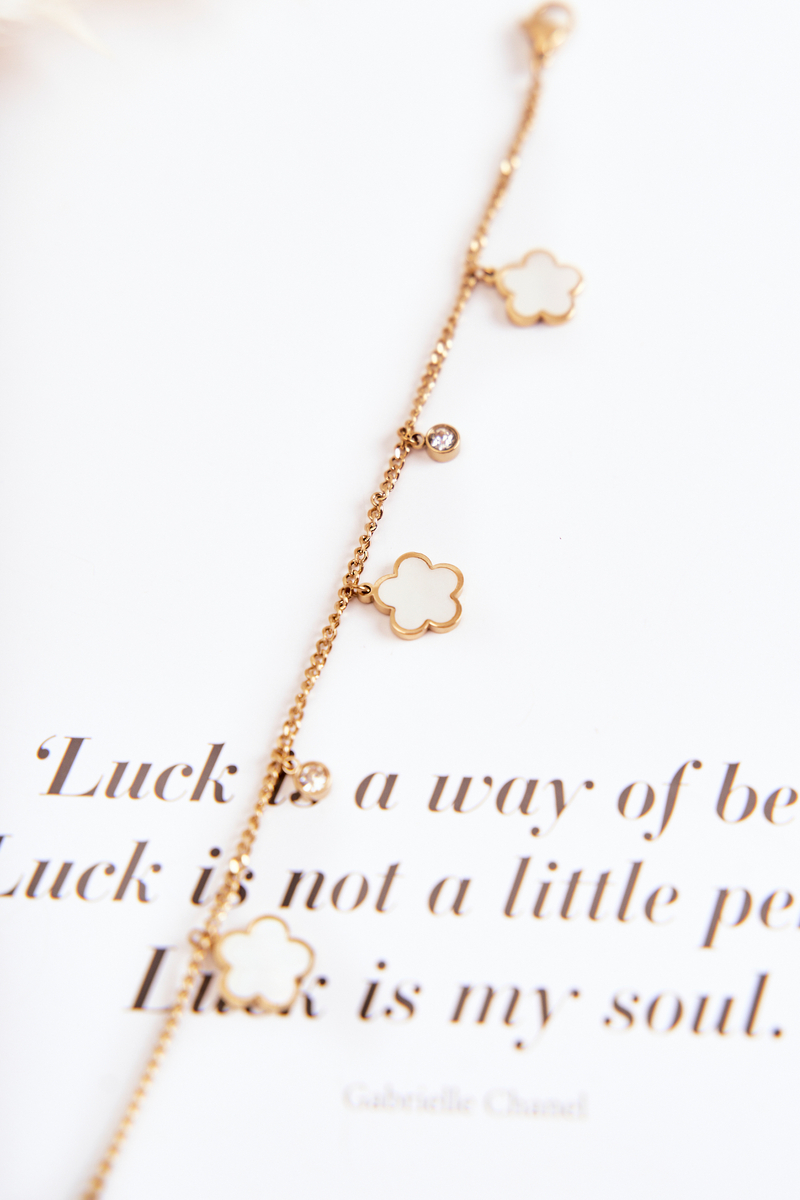 Bracelet on a chain with golden-white flowers