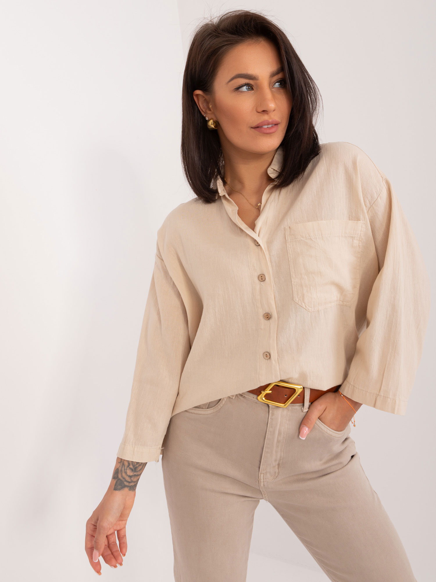 Beige loose women's shirt with button fastening
