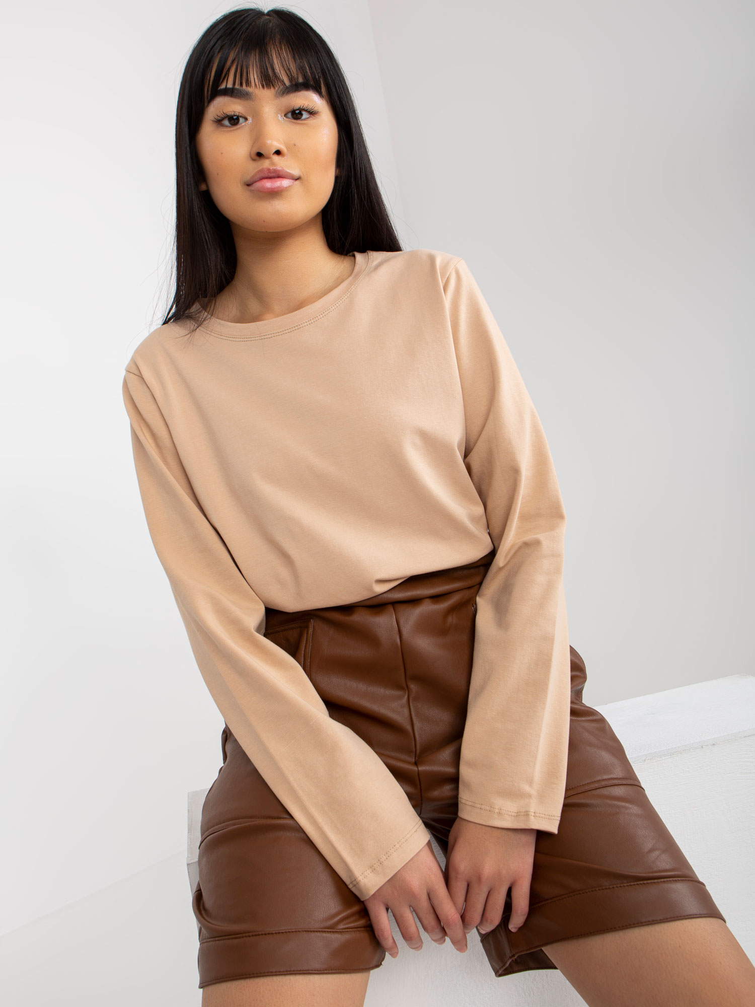 Monochrome beige blouse with long sleeves and round neckline