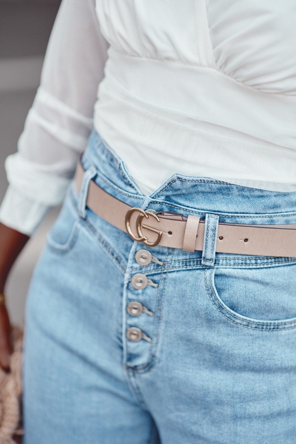 Leather belt with gold buckle of beige color