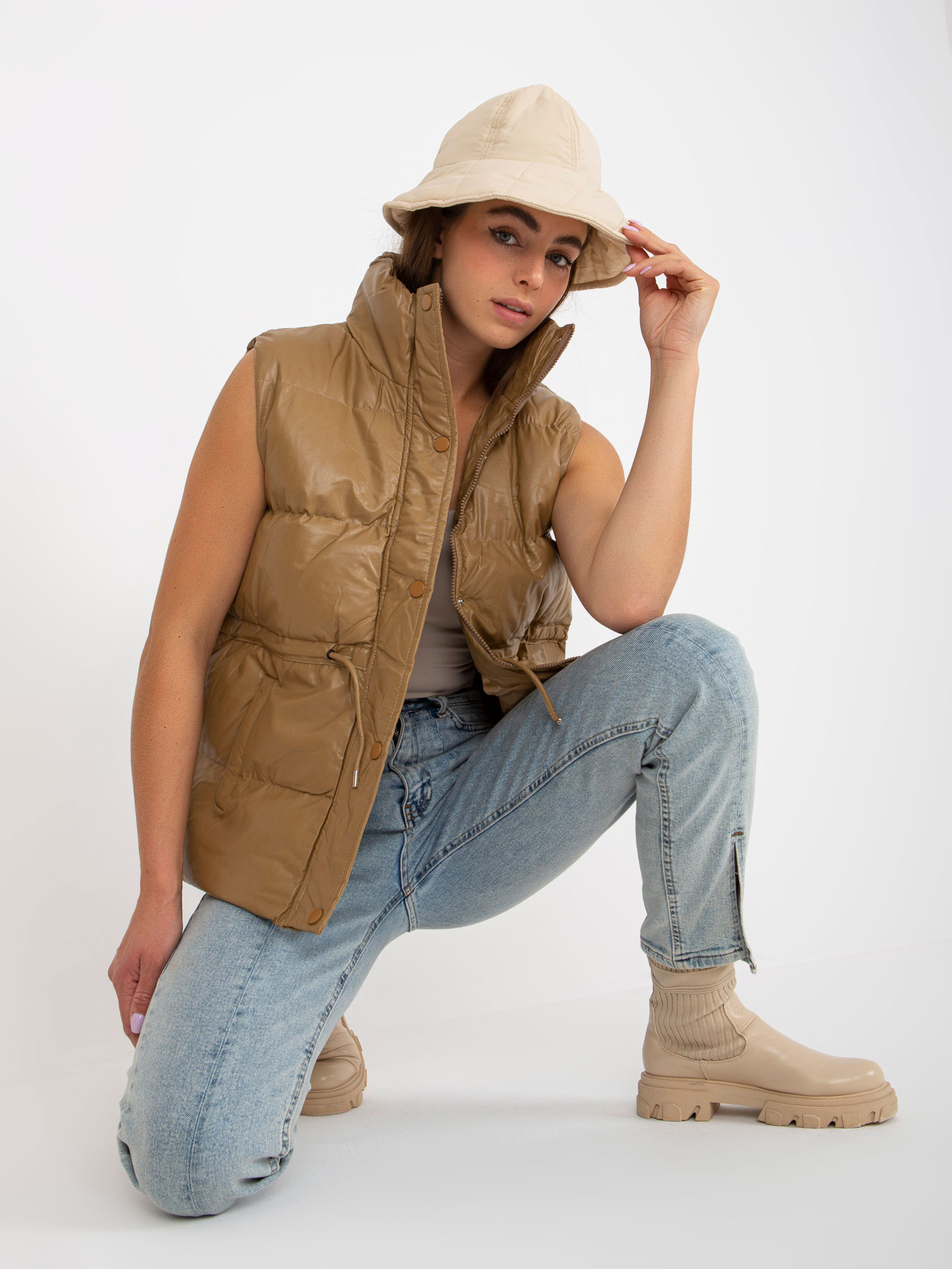 Camel vest made of eco-leather with stitching